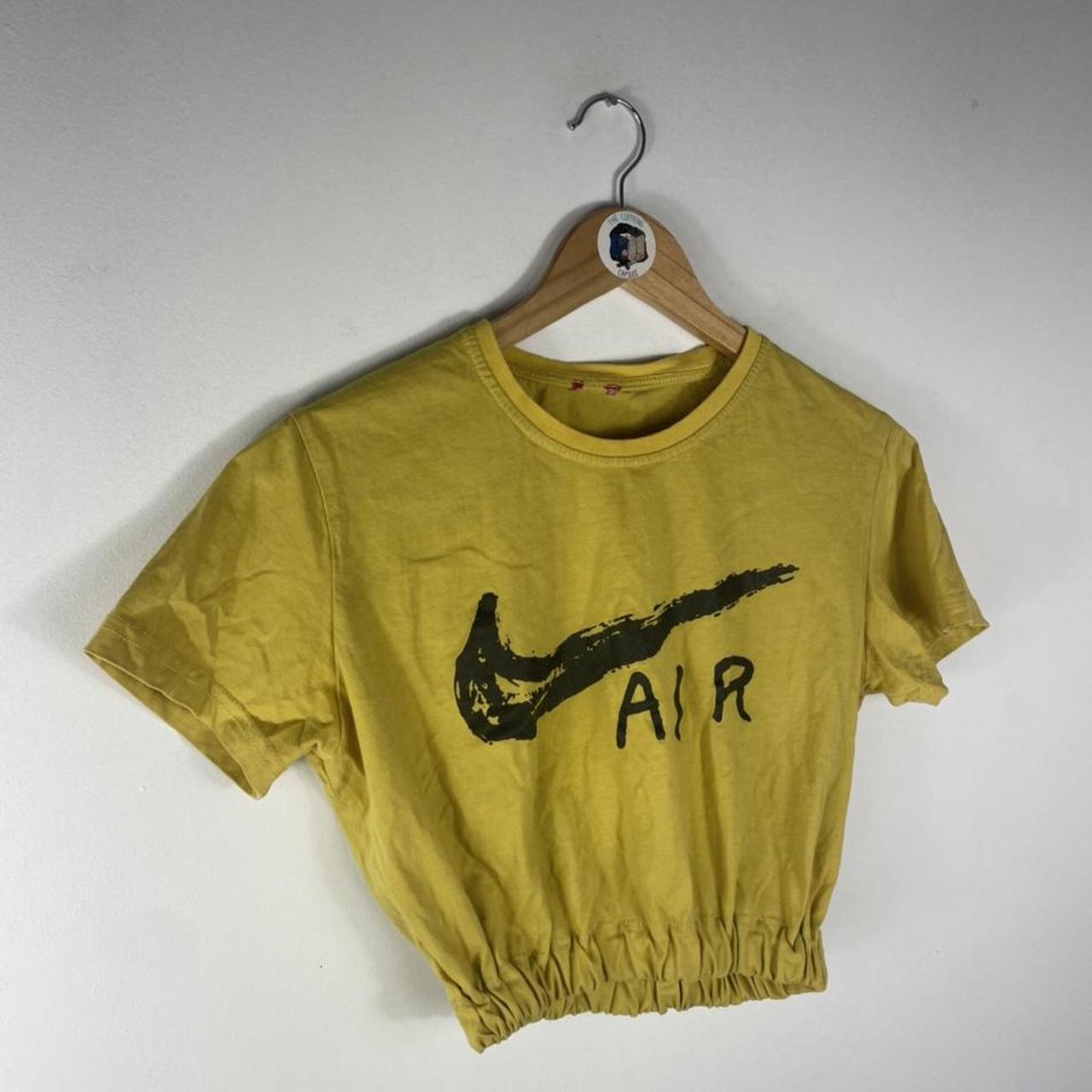 mustard color nike shirt