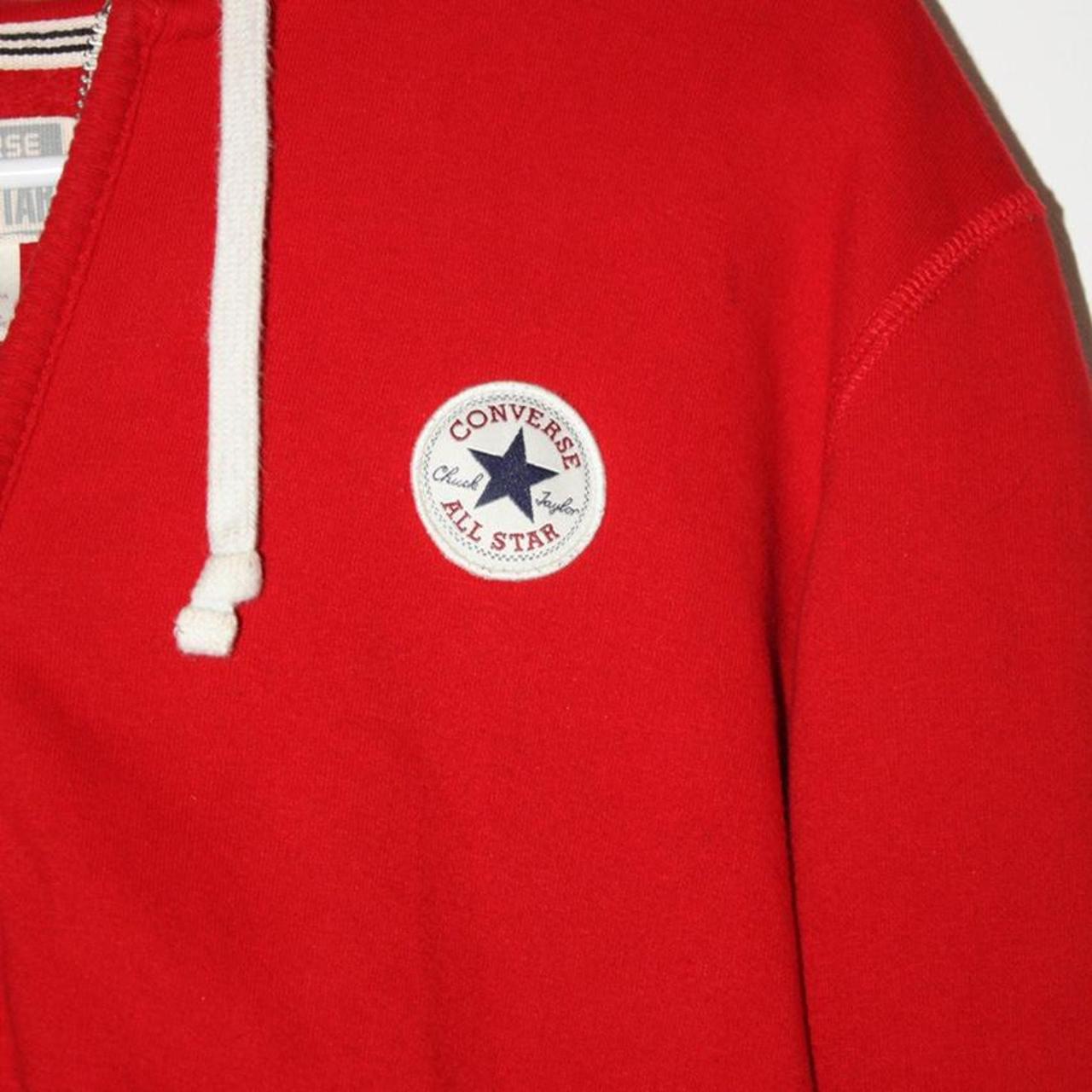 A bright red converse hoodie! Its in perfect... Depop