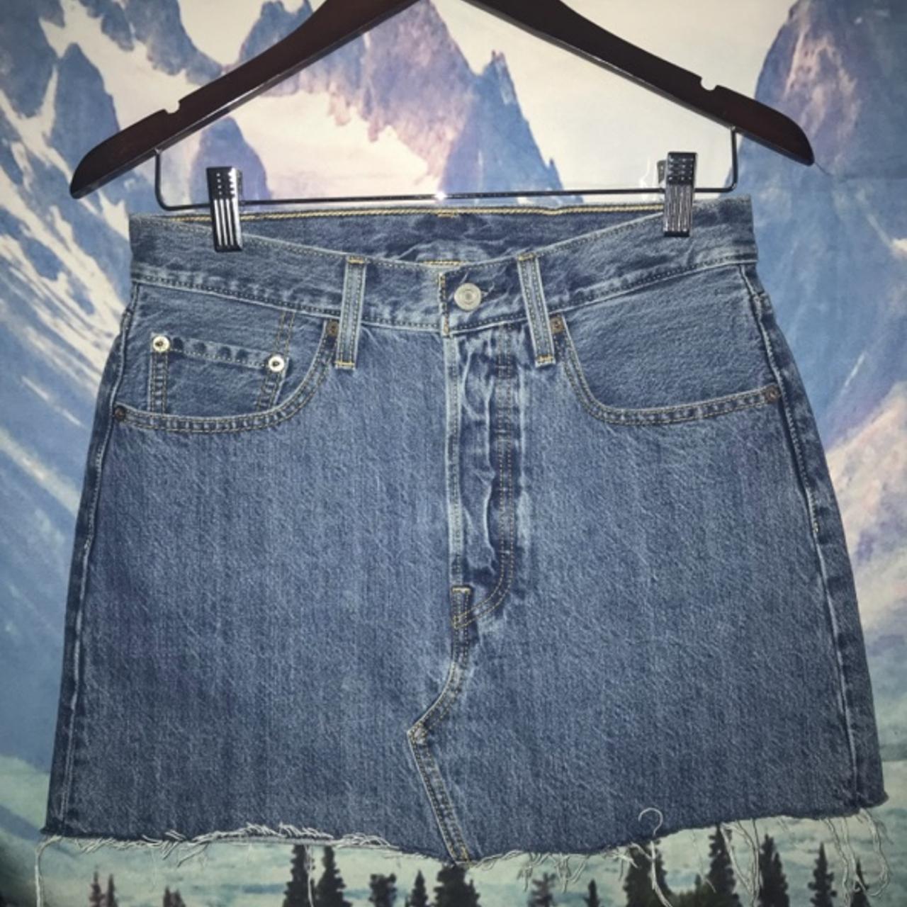 Levi’s Jean Skirt -has a button down closure in the... - Depop