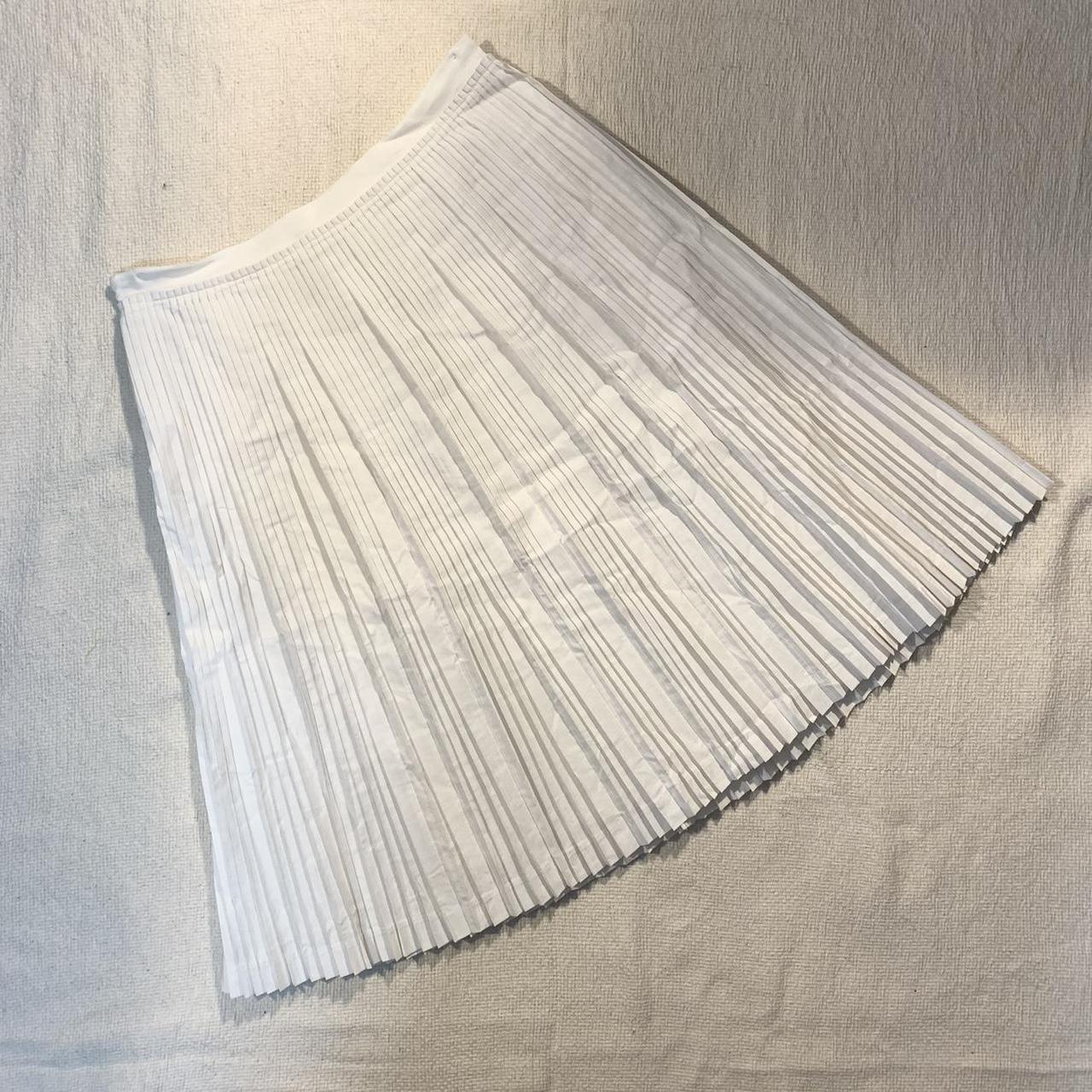 White midi skirt. Pleated. Fabric almost has the... - Depop