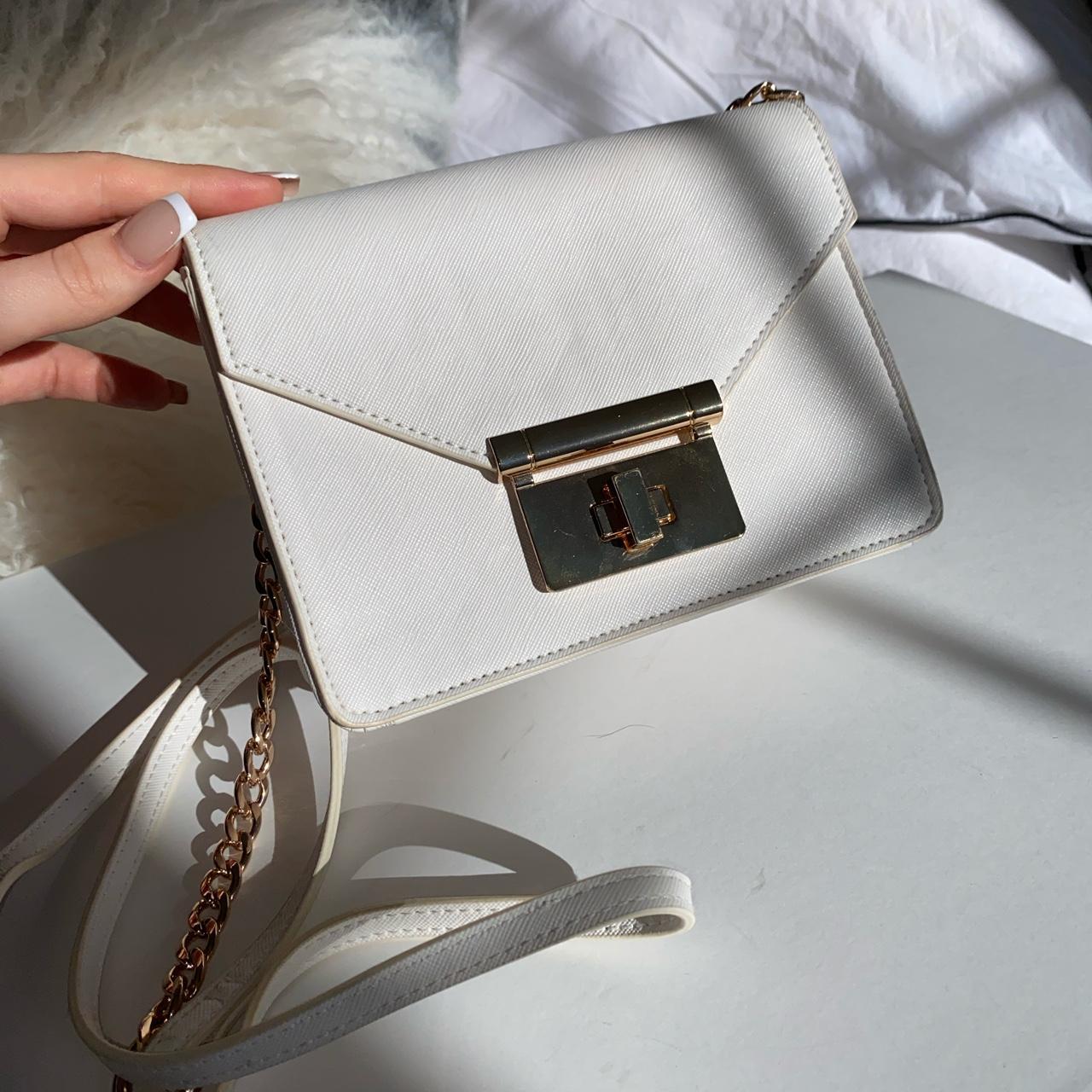 Beautiful white cross body bag with gold hardware.... - Depop