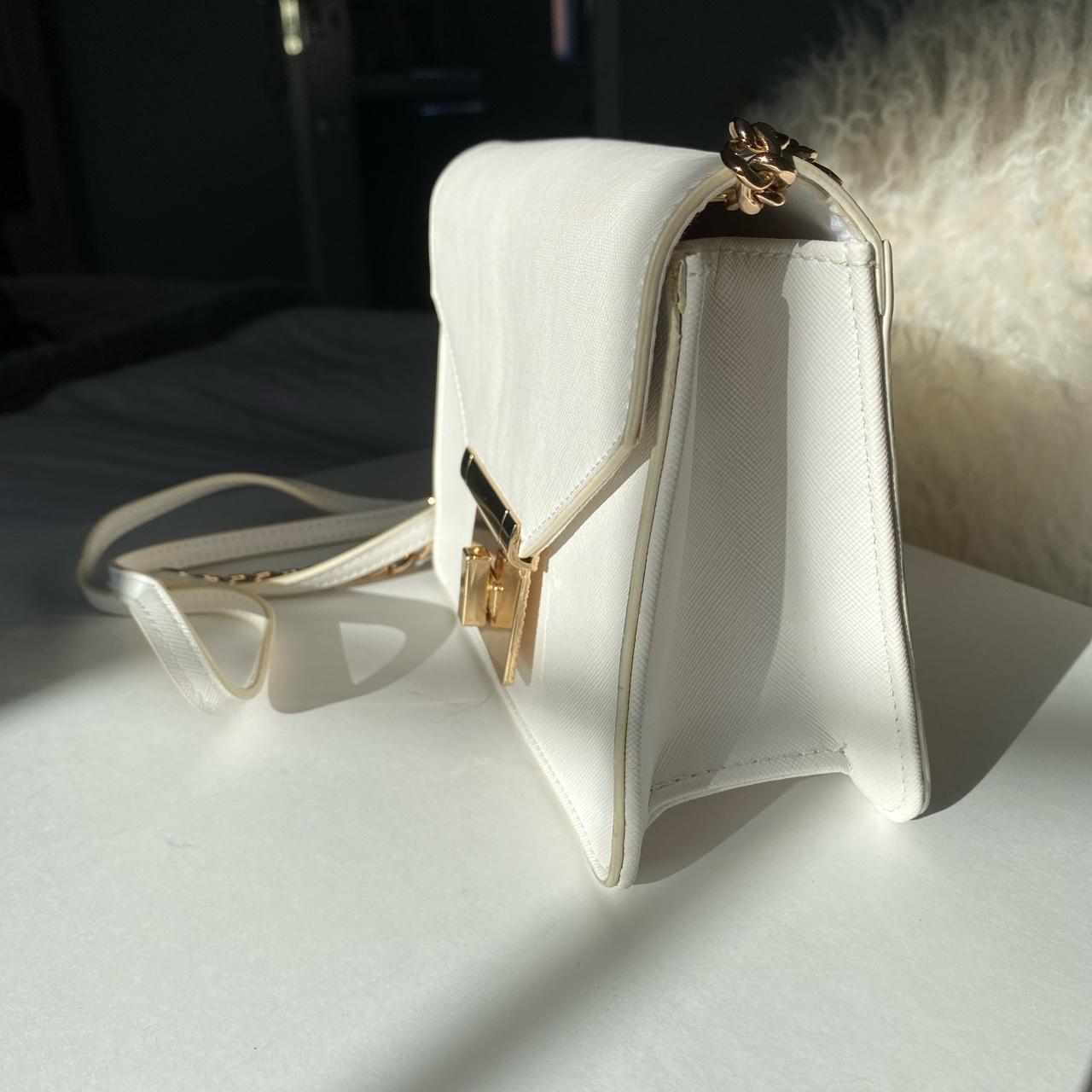 Beautiful white cross body bag with gold hardware.... Depop