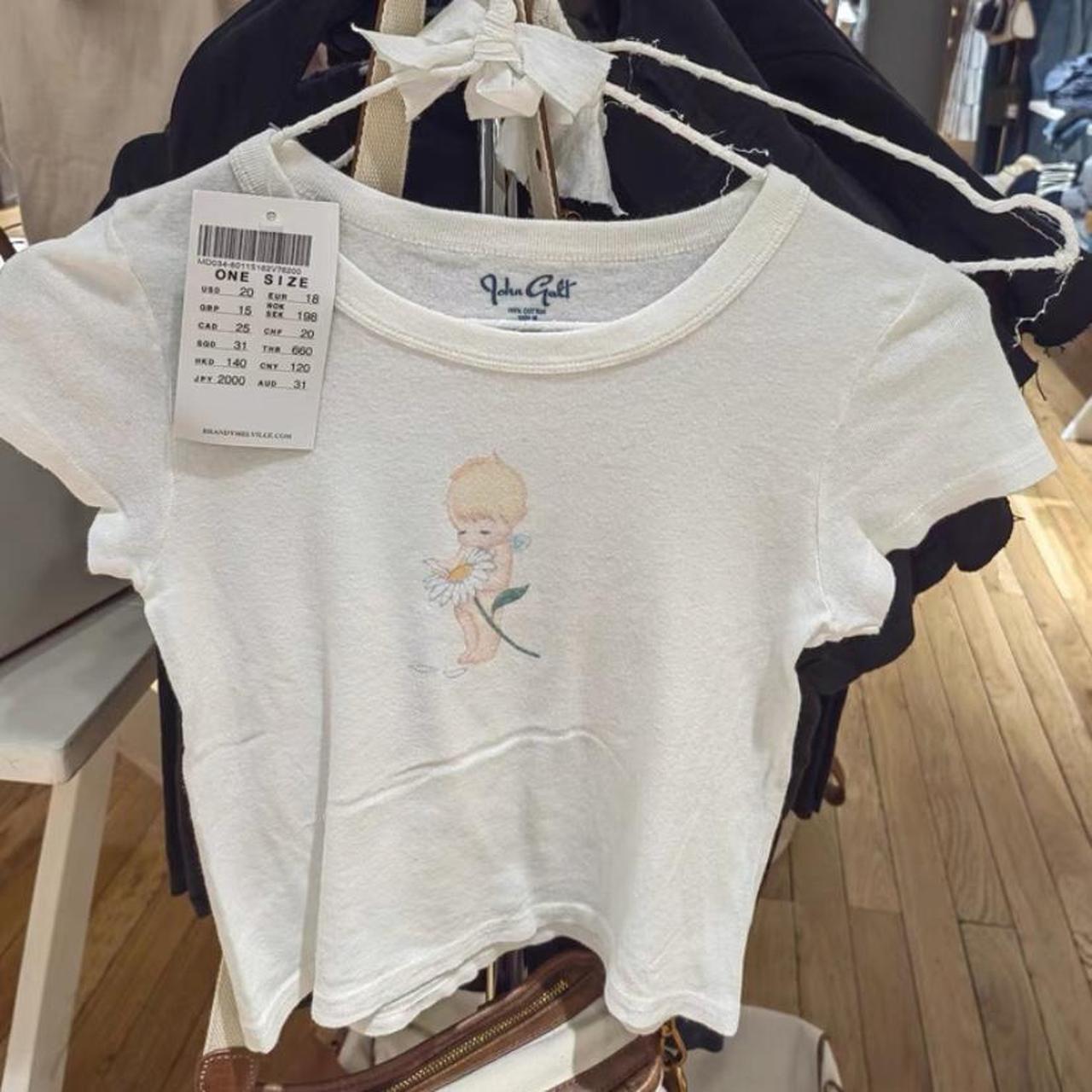 Preorder Brandy Melville flower cherub Ashlyn top... - Depop