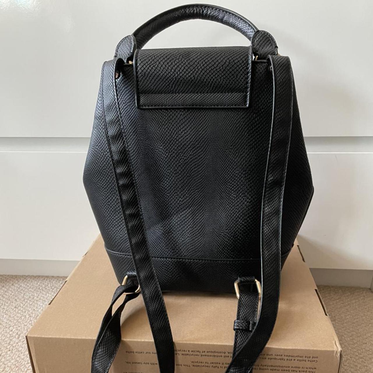 Black Dune Backpack with studs and adjustable... Depop