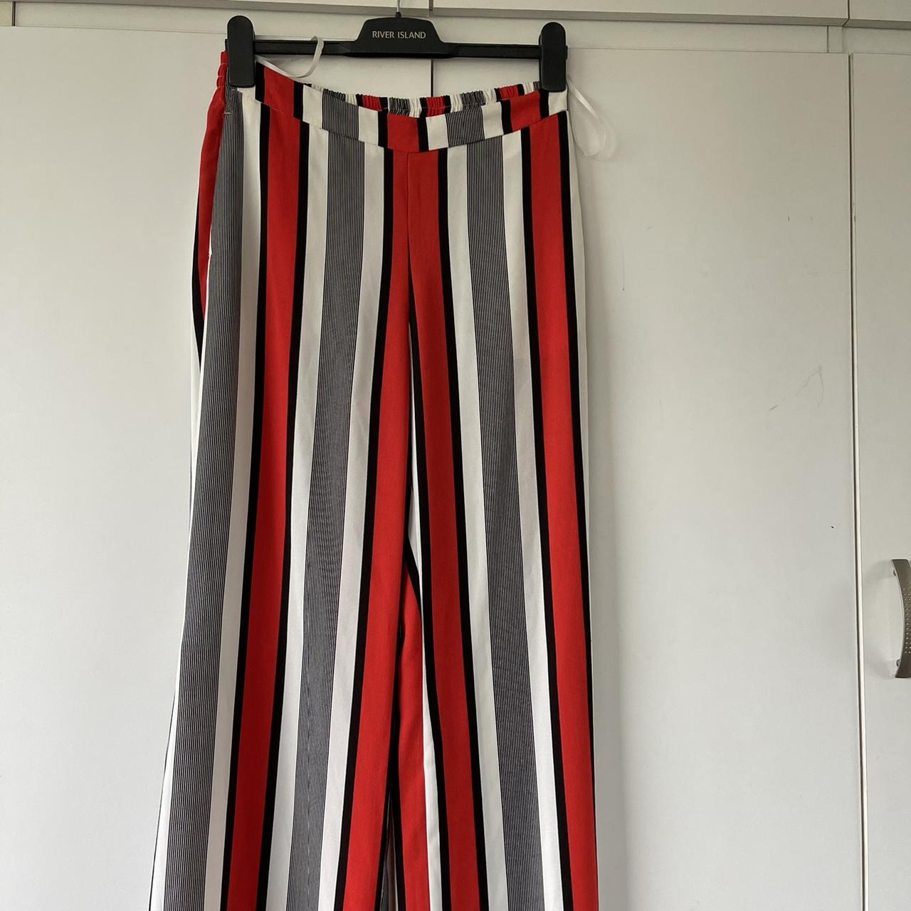 Black/White/Red striped trousers, they have a slit... - Depop