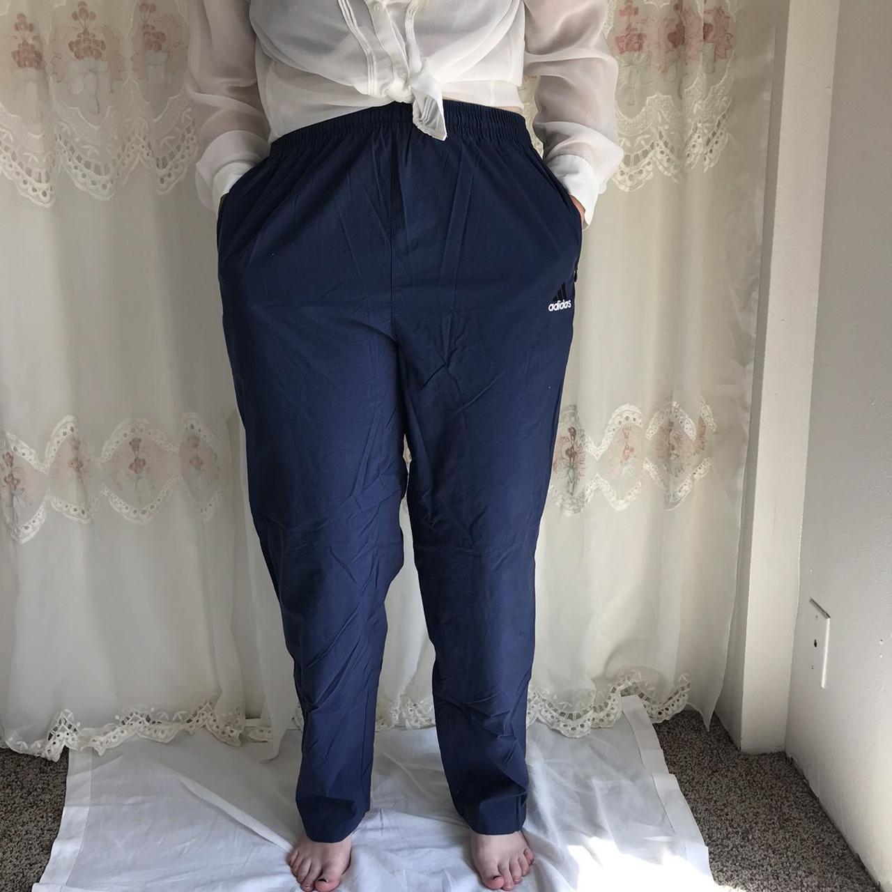 Navy blue adidas zipper pockets track pants, zipper... Depop