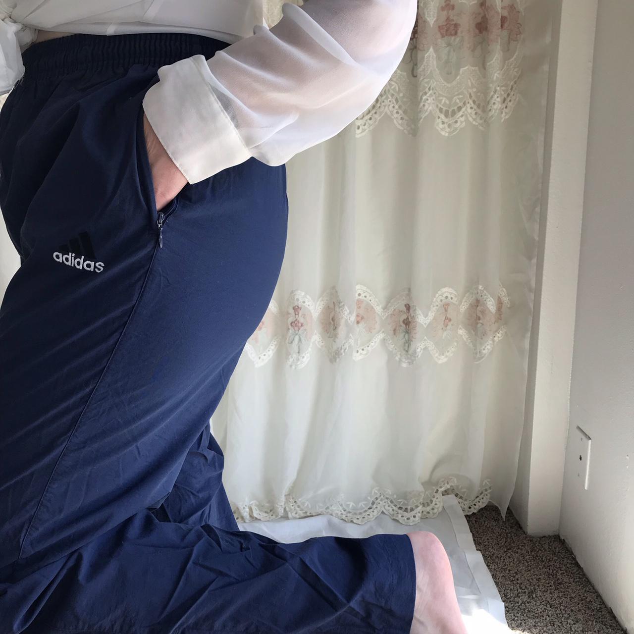 Navy blue adidas zipper pockets track pants, zipper... Depop