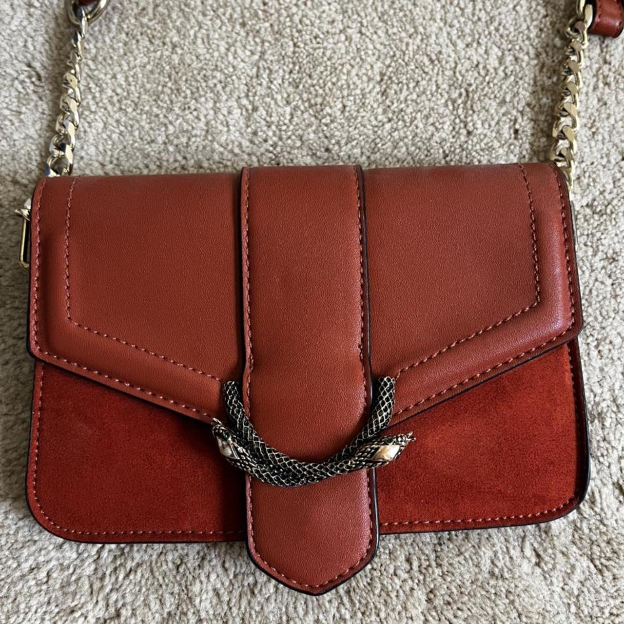 Sela snake discount cross body bag