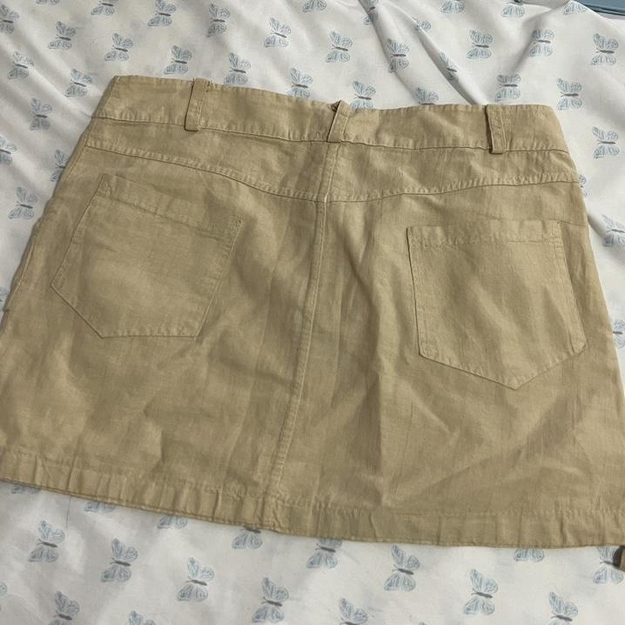 beige cargo skirt with pockets in the front. Great... - Depop