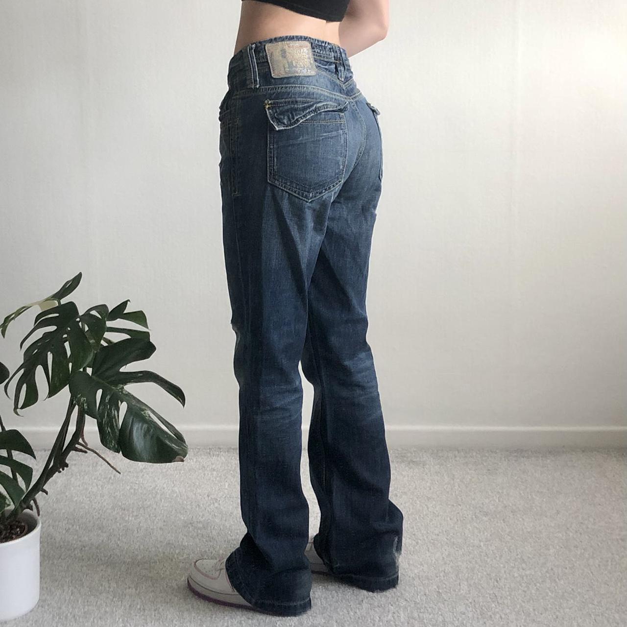 Y2K low rise distressed flared jeans in a dark wash... - Depop