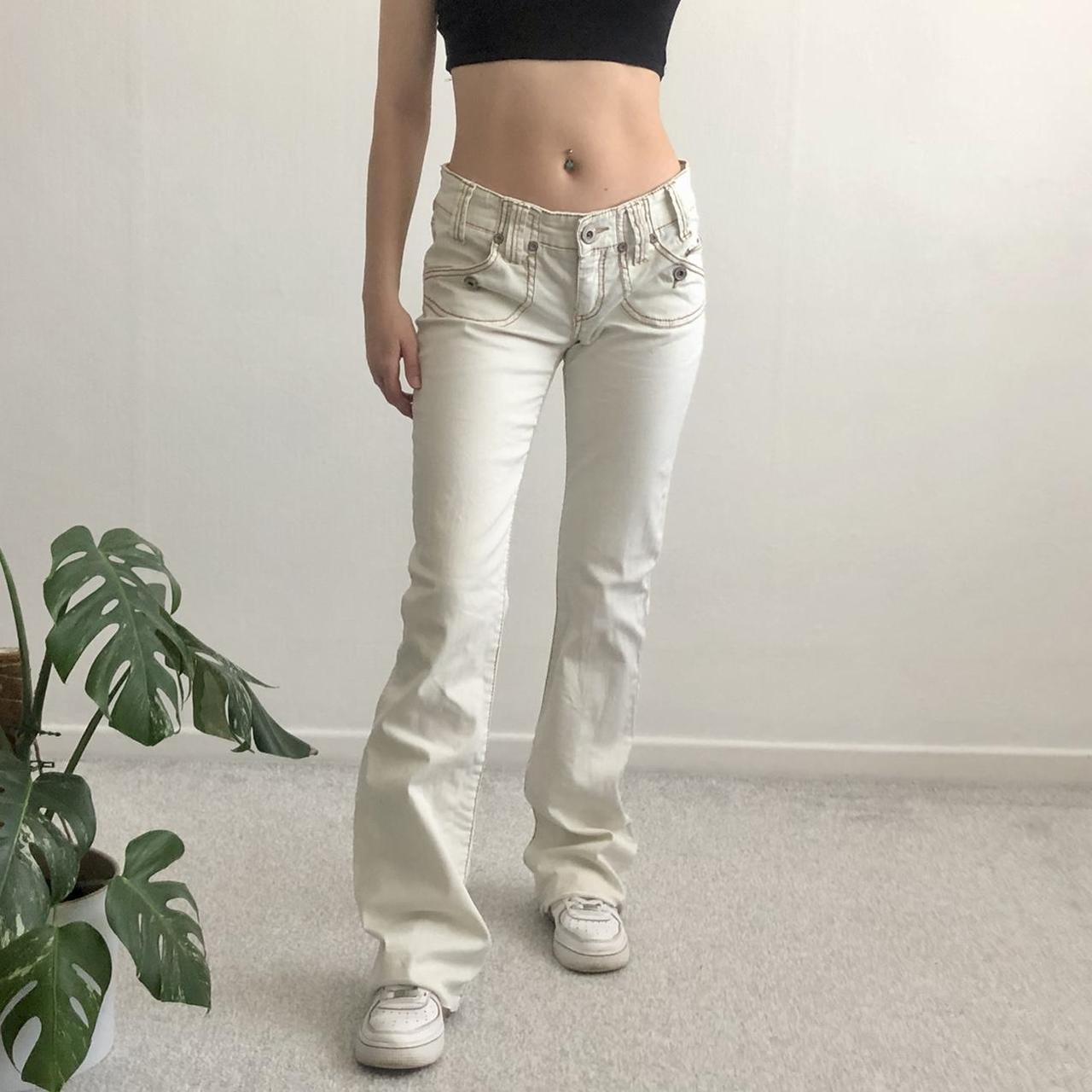 Y2K low rise flared jeans in a cream wash... - Depop