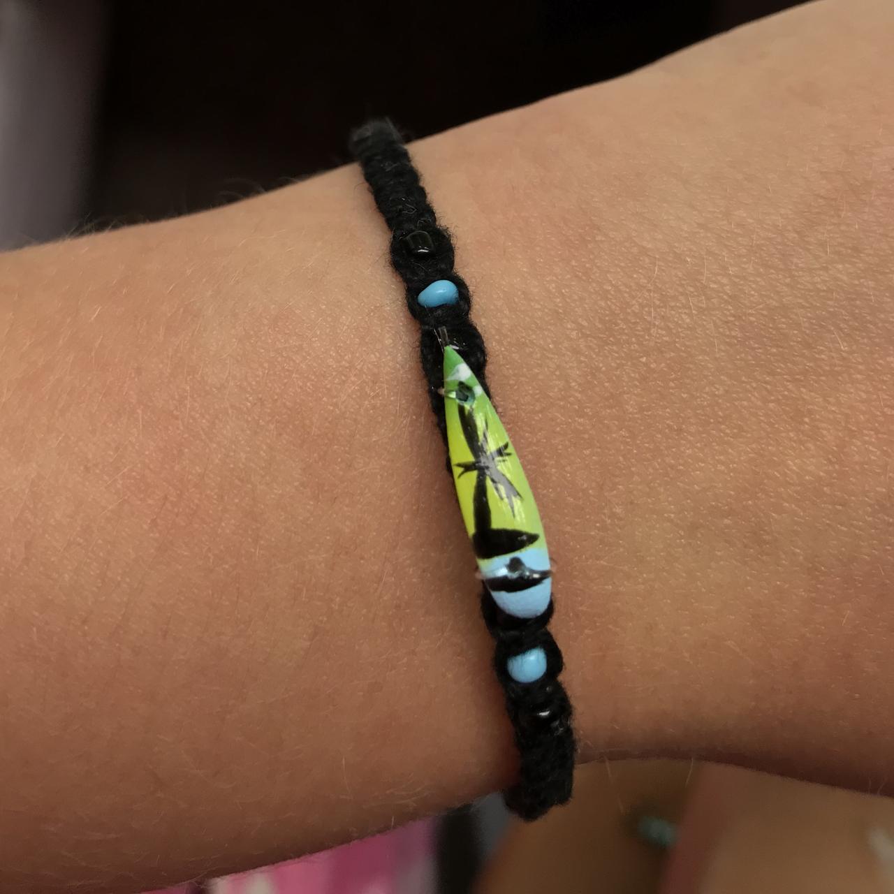 This bracelet the surfboard is smaller than the