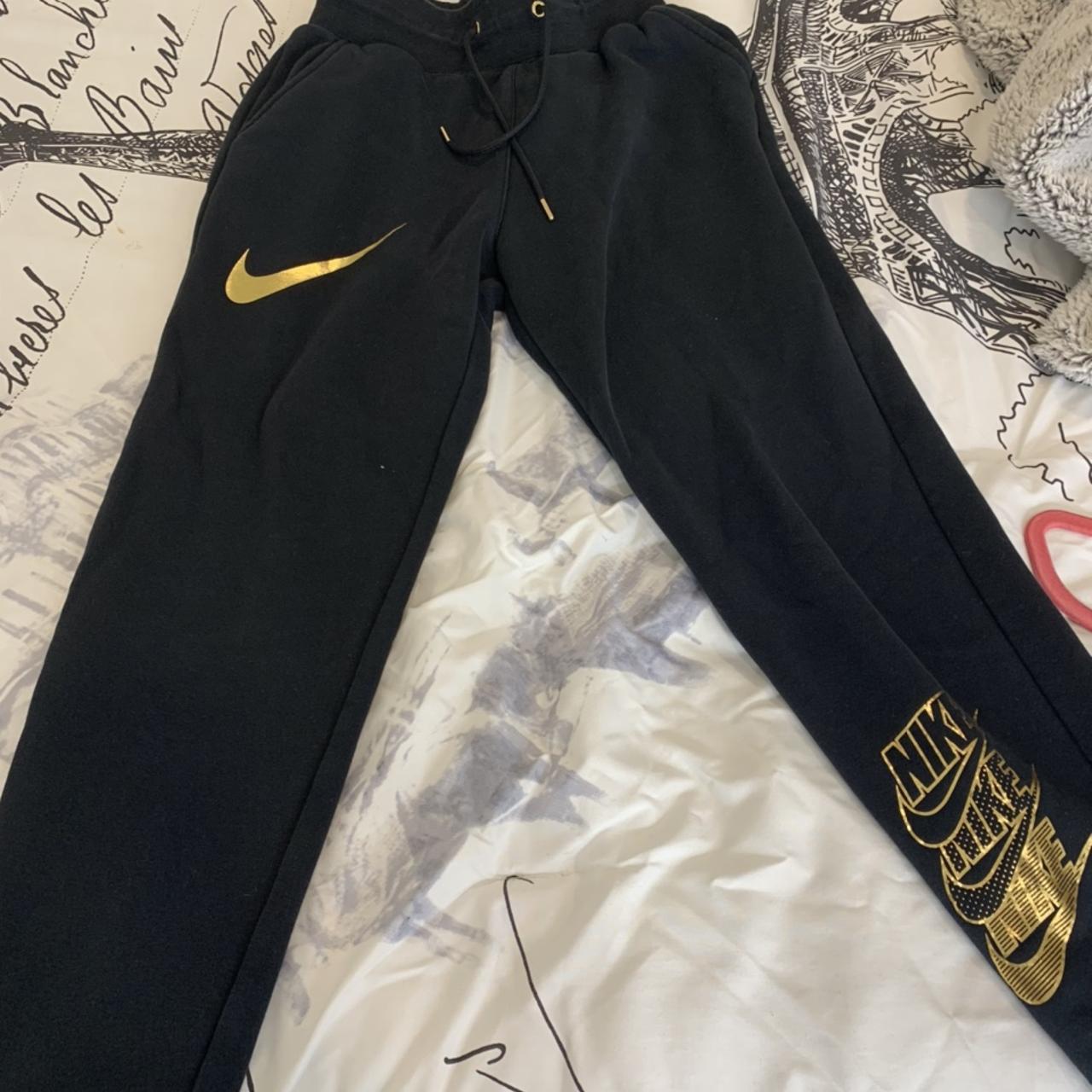 nike black and gold joggers