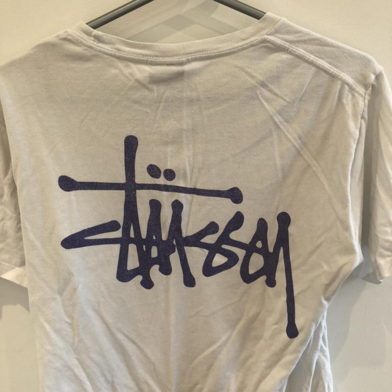 White stussy tee with purple logo. Good condition... - Depop