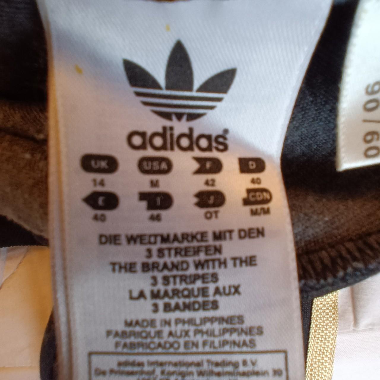 Black and gold Adidas track top,womens, excellent... Depop