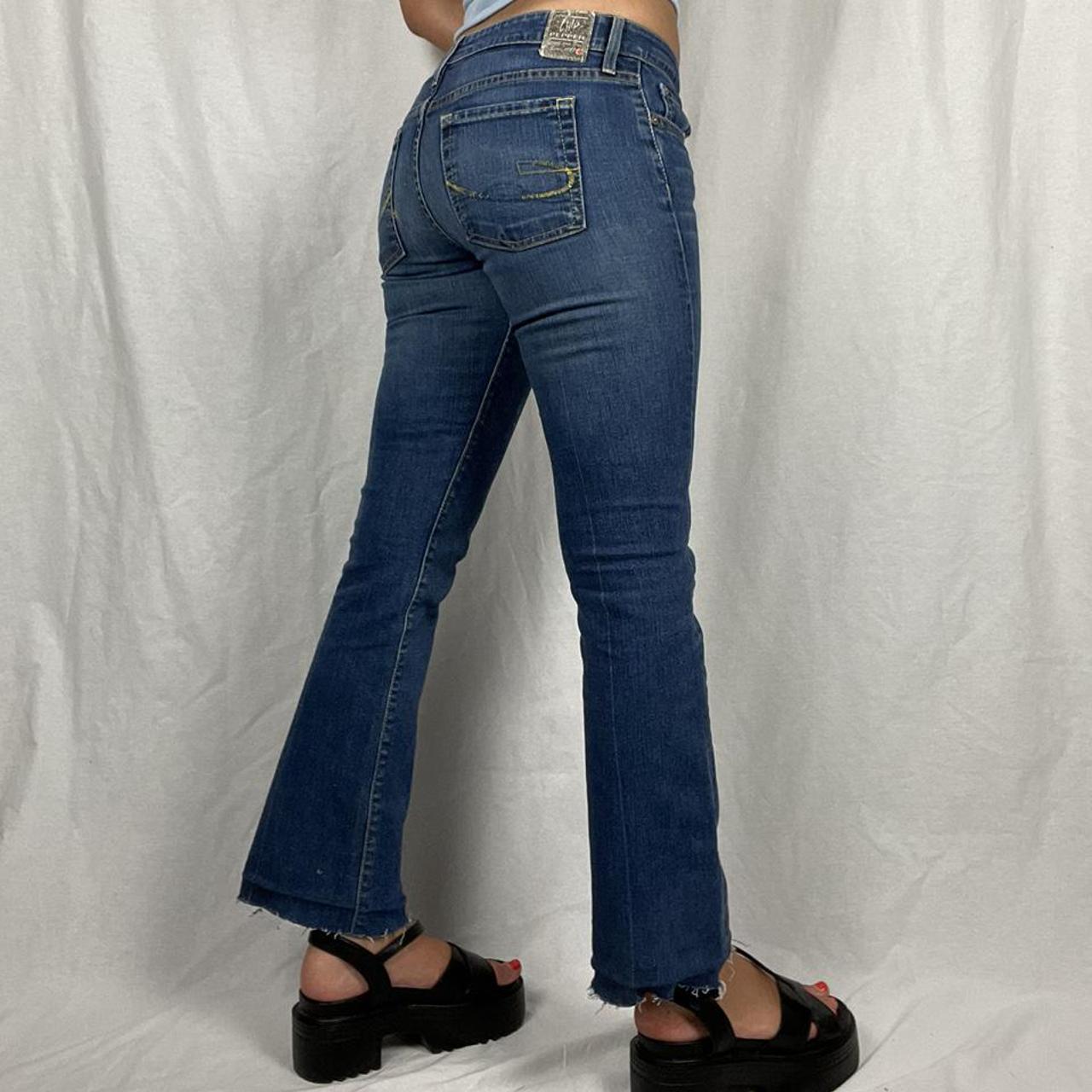 y2k low rise flare jeans bottom was hemmed to be... - Depop