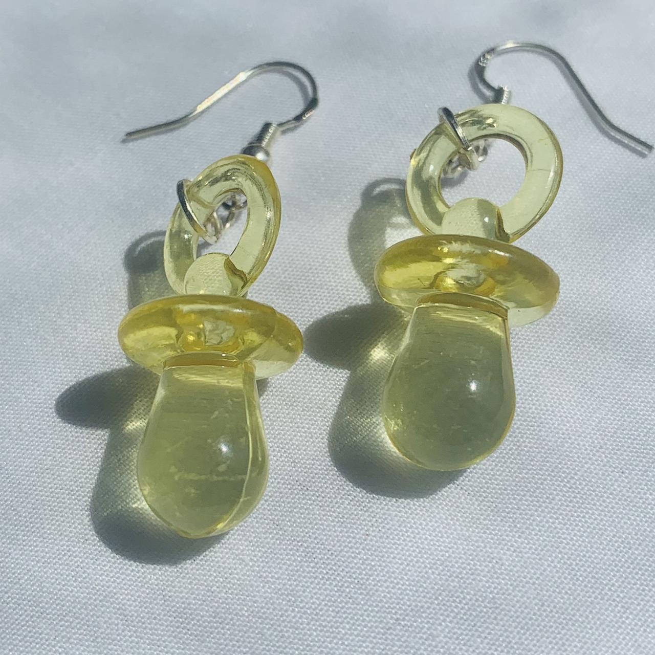 Yellow acrylic charm baby dummy earrings... Depop