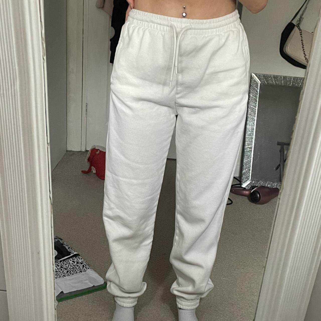 Plain white joggers with tie at the front. Cuffed... - Depop
