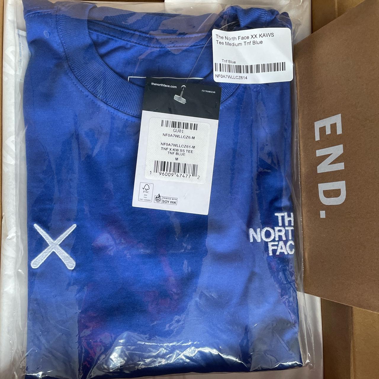 Kaws x The North Face tnf blue t shirt... - Depop