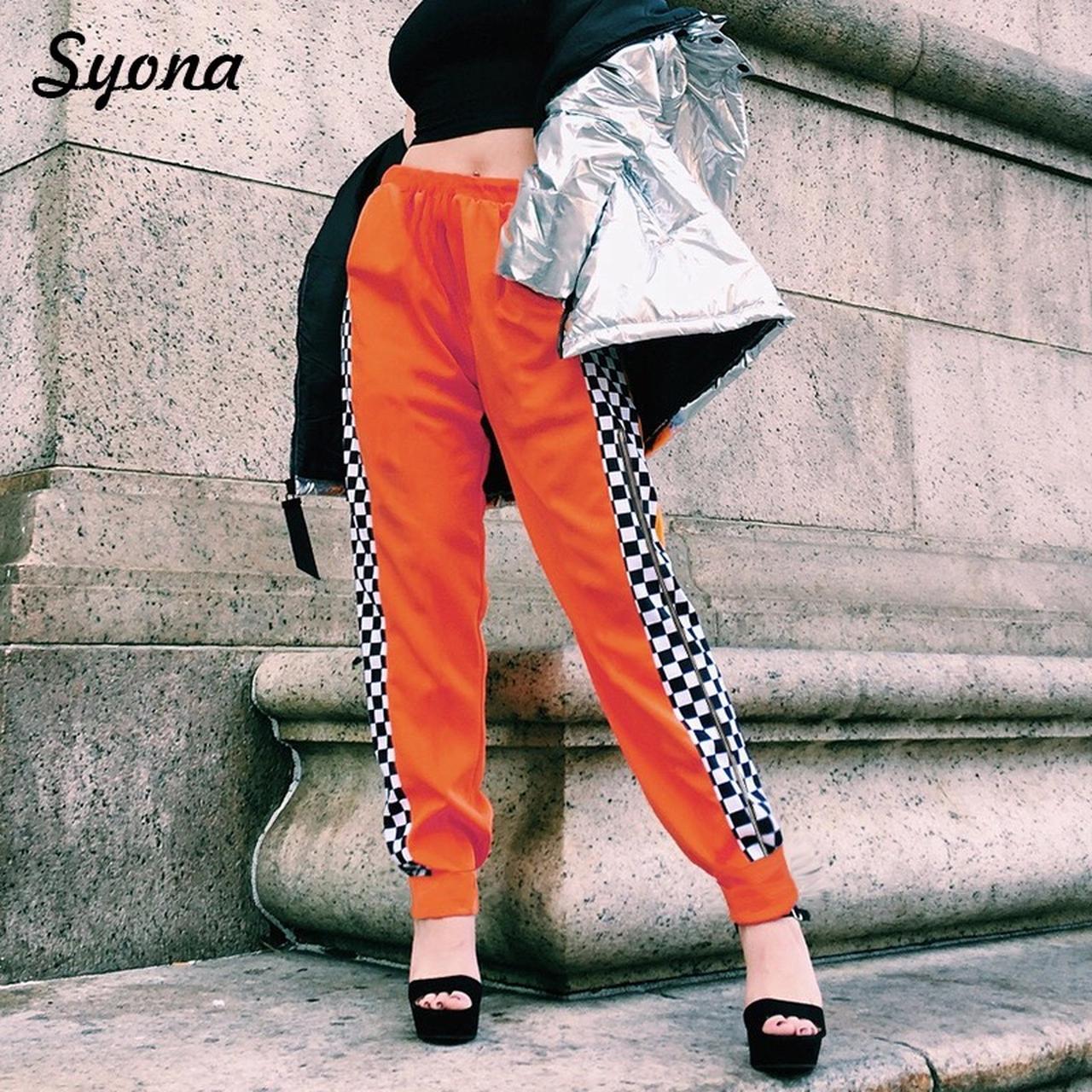 Orange and store black striped pants