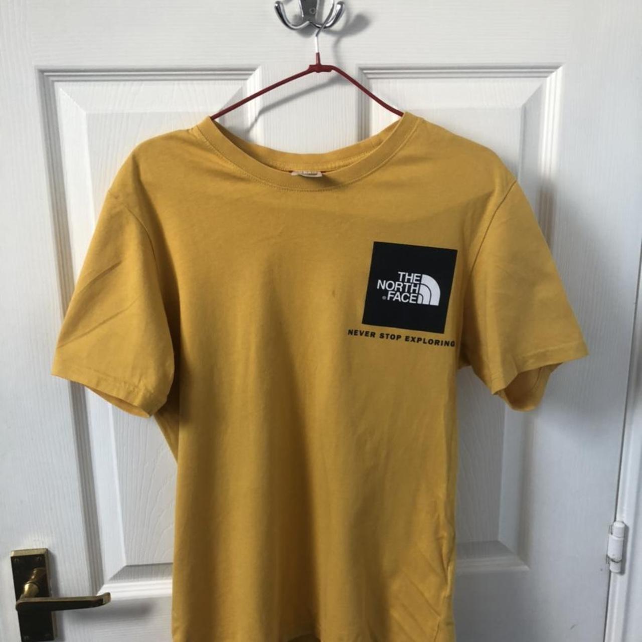 The North Face Spellout Mustard short sleeved t... Depop