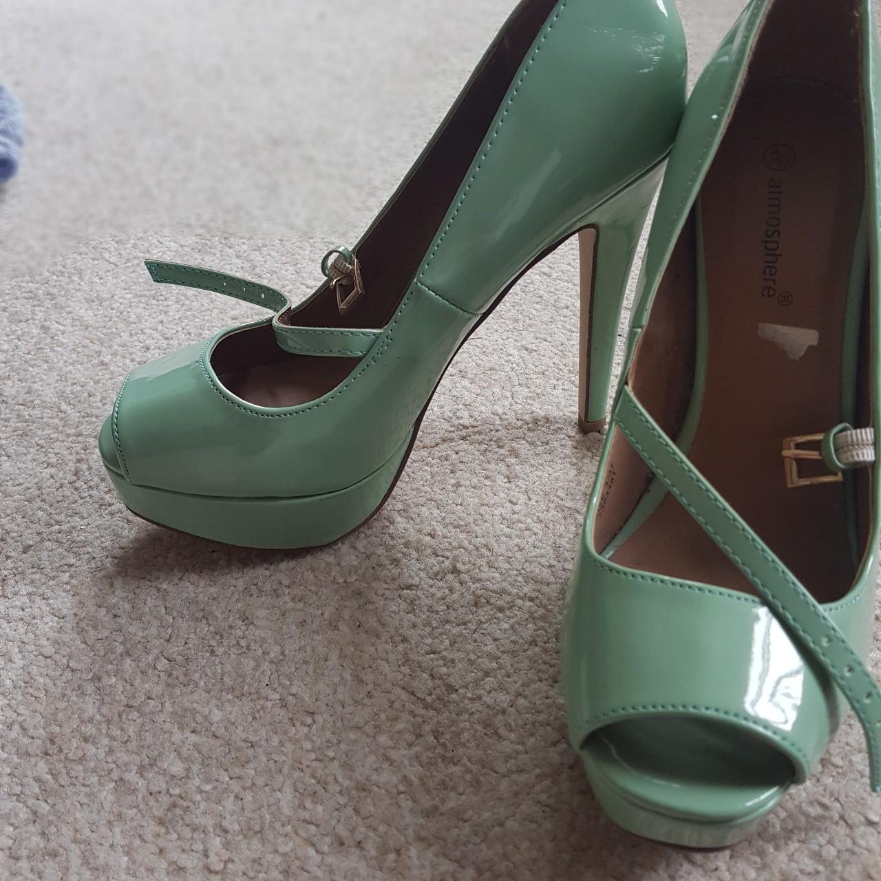 Mint green peep toe stiletto heels has a buckle. Depop