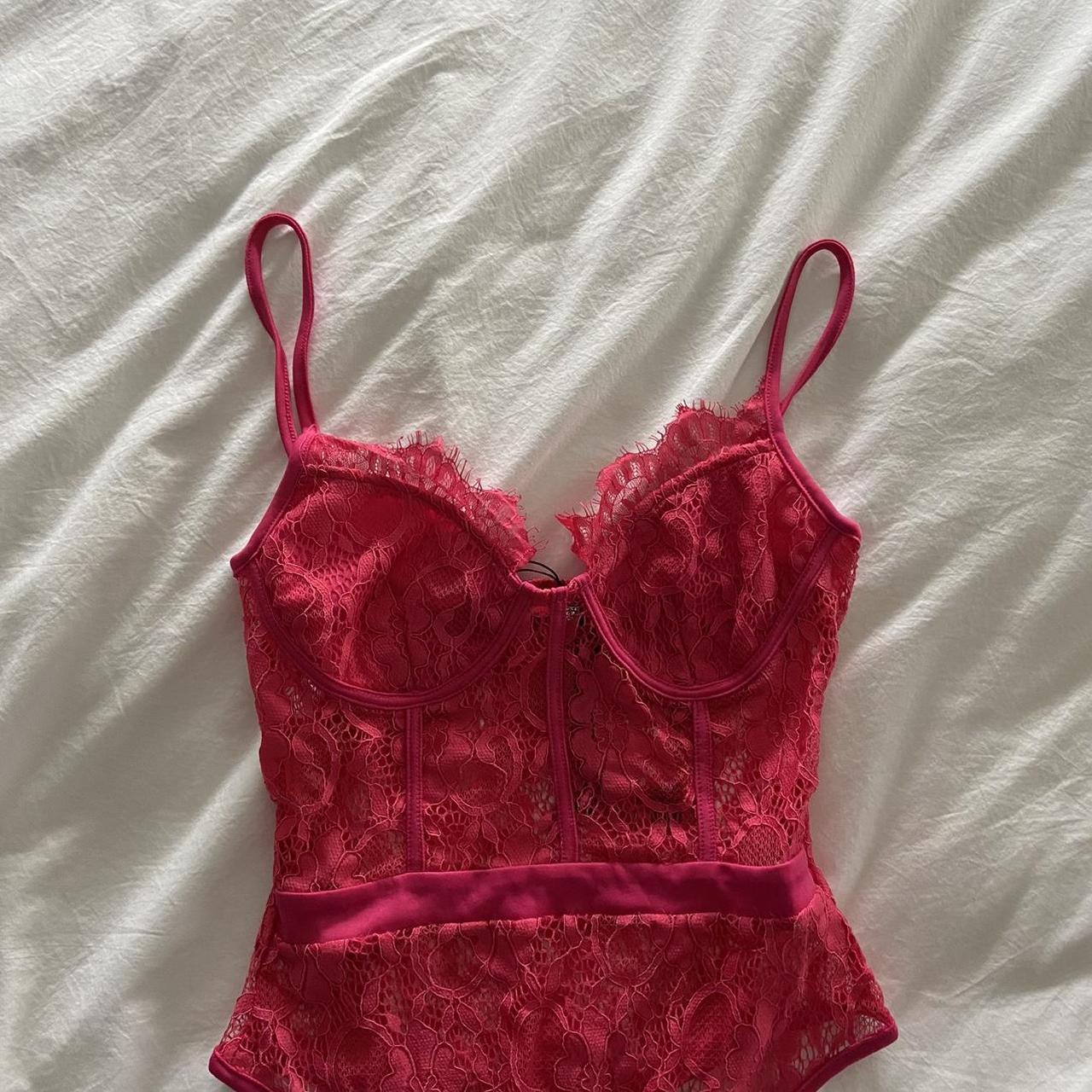 Bright pink lace thong bodysuit from in the... - Depop