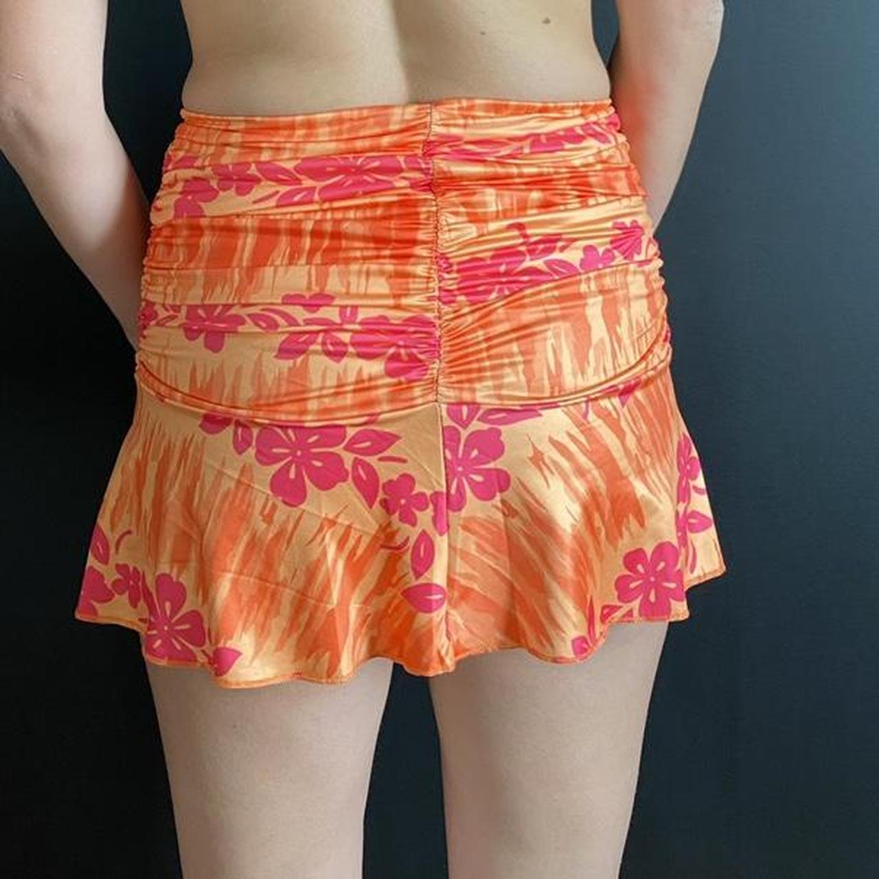 Adorable ruched hibiscus mini skirt. Swim material... - Depop