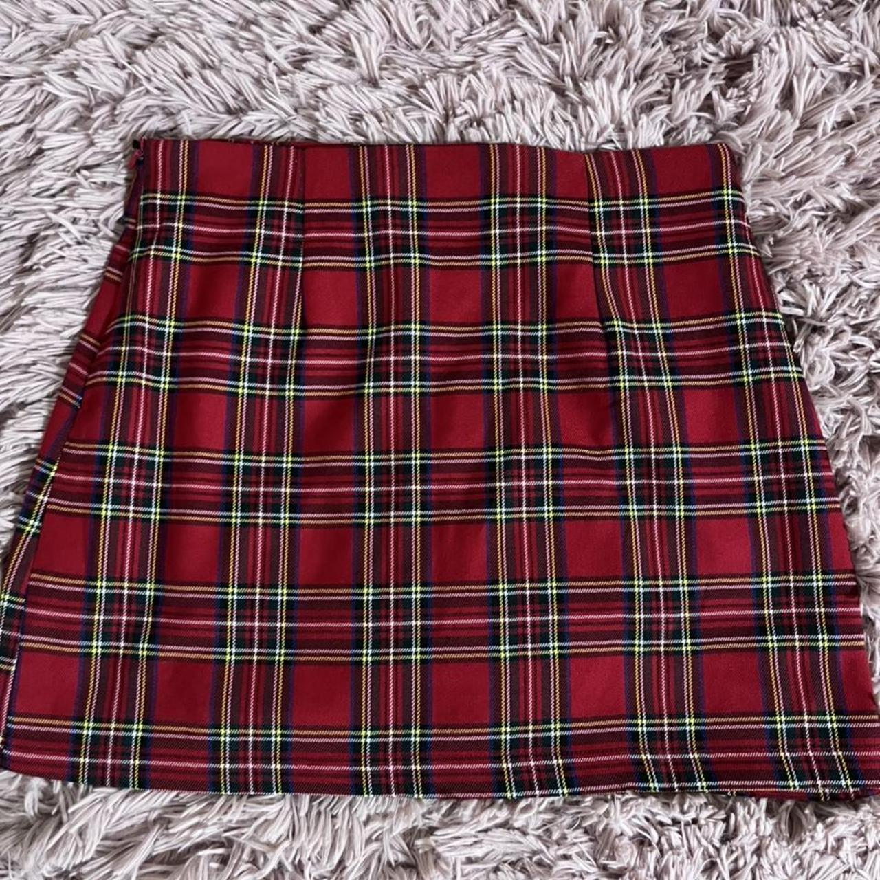 Red plaid schoolgirl skirt with side buckle detail... - Depop