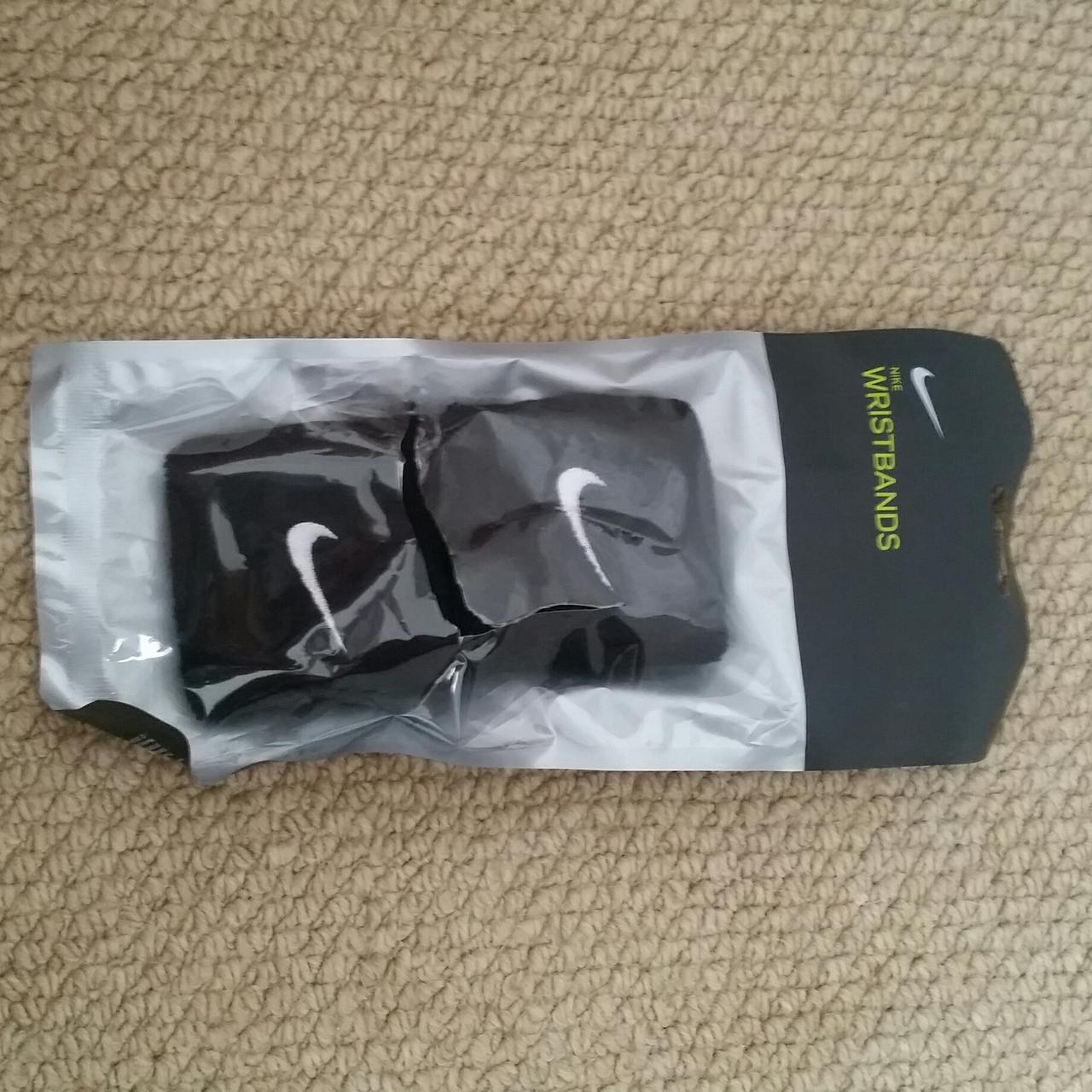Nike wristbands Packet has large rip in it Never used - Depop