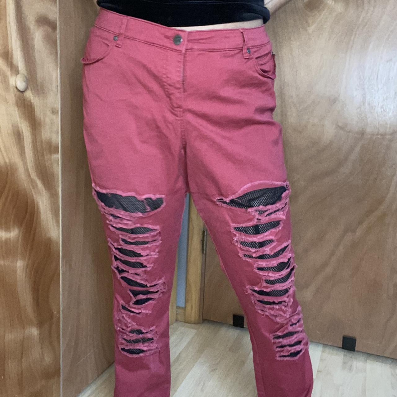 red ripped pants
