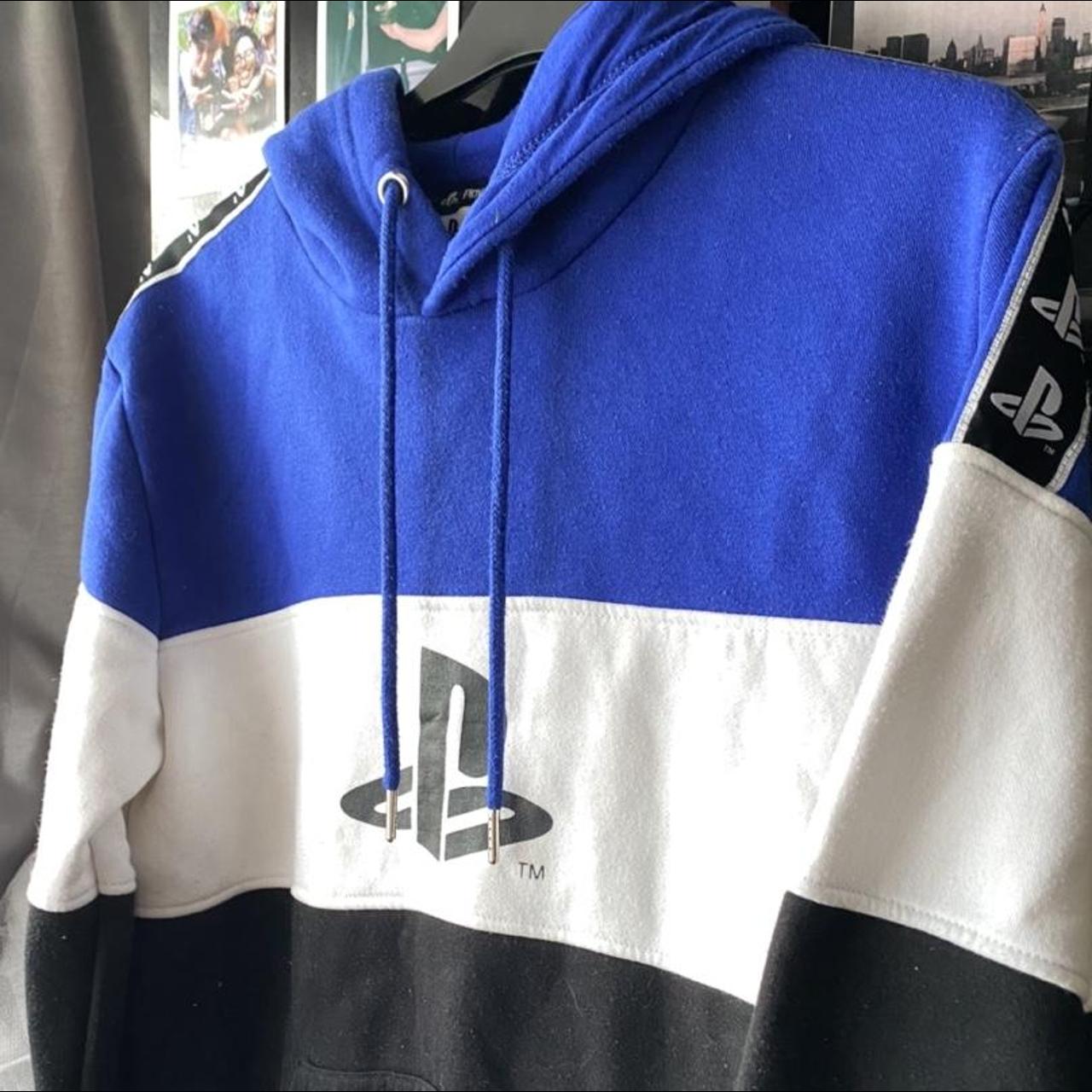 blue, white and black hoodie with playstation logo.