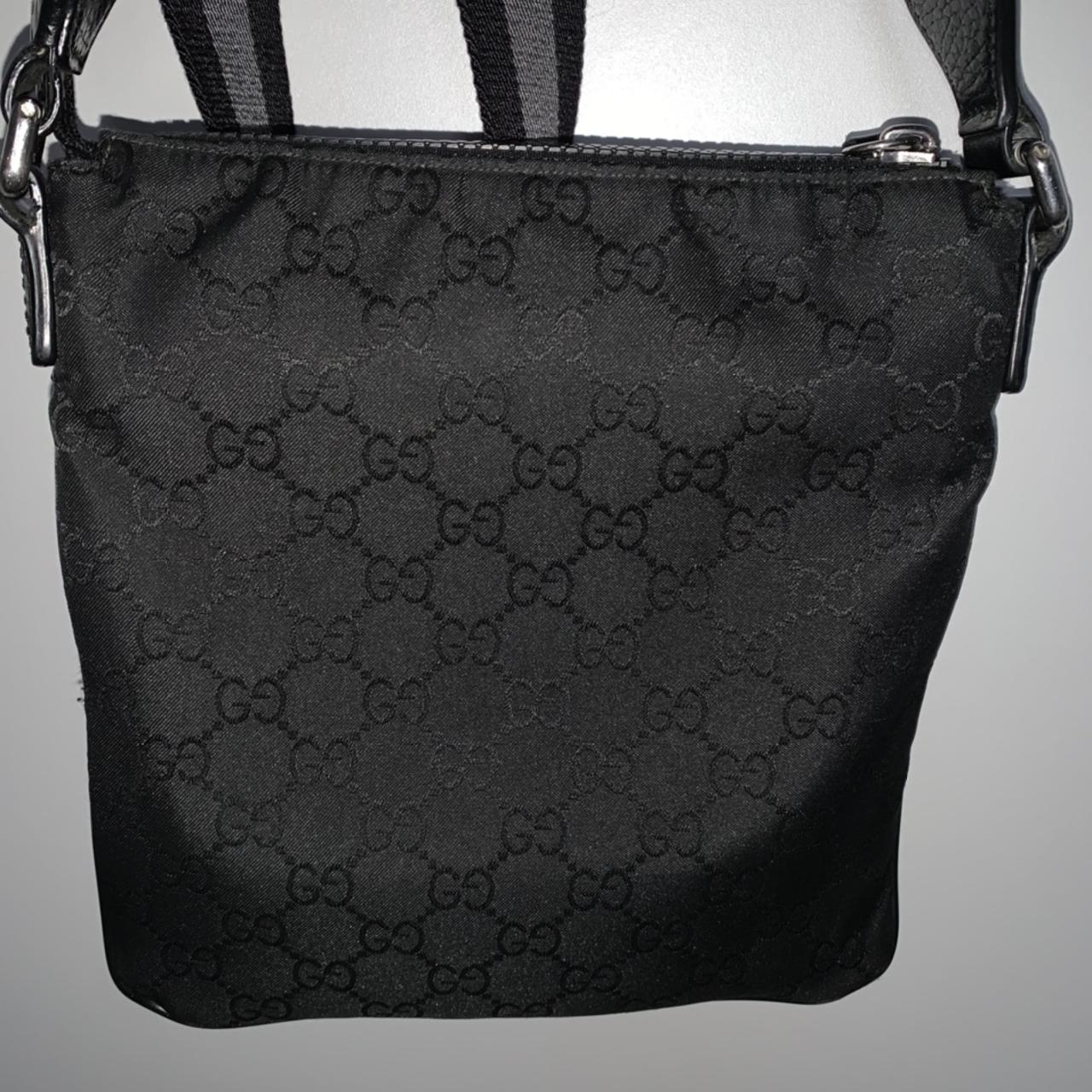 Gucci logo bag in black. Missing a tag on a zipper. - Depop
