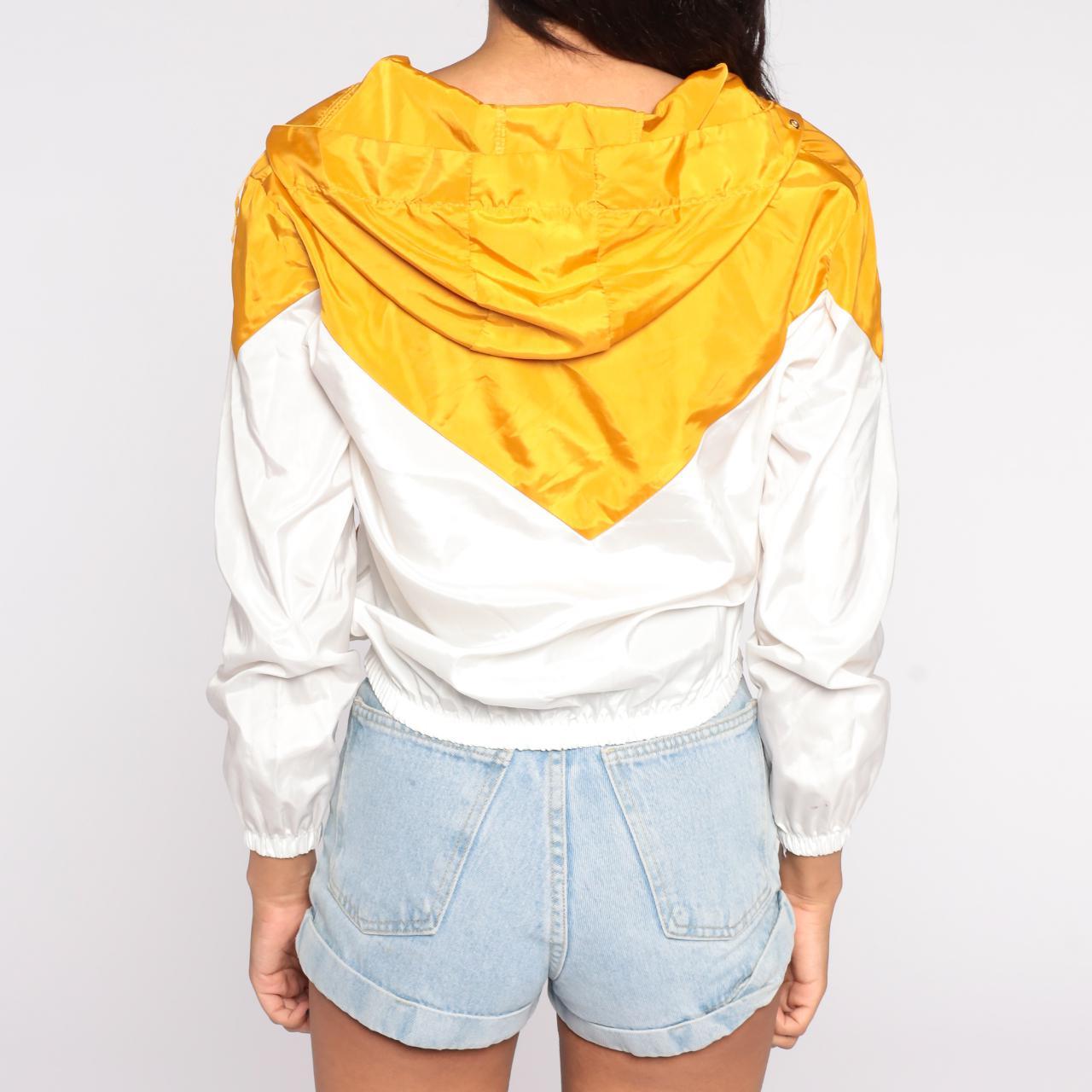 Modern windbreaker in yellow and white color block... Depop
