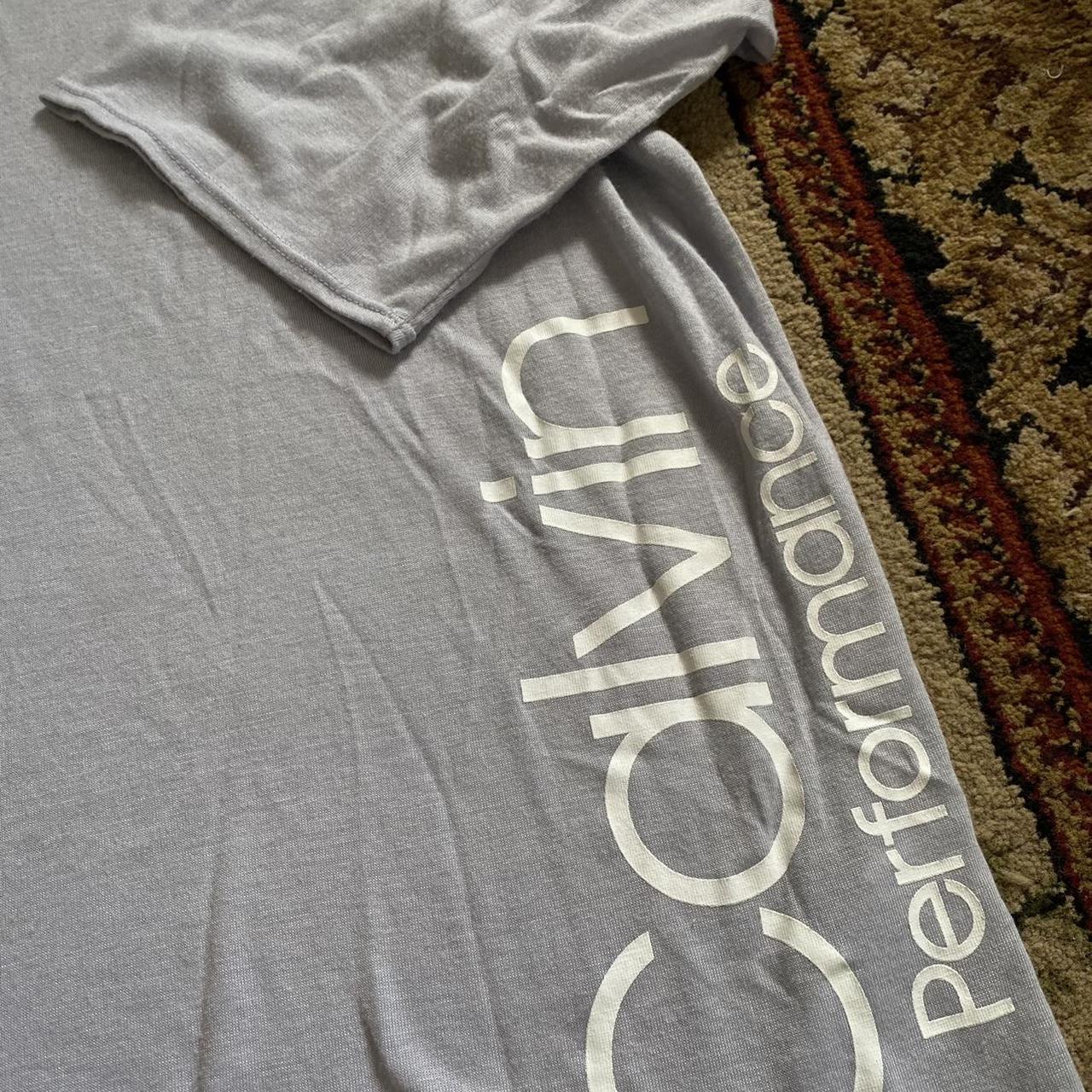 Calvin Klein Sportswear Women's Blue and White Tshirt Depop