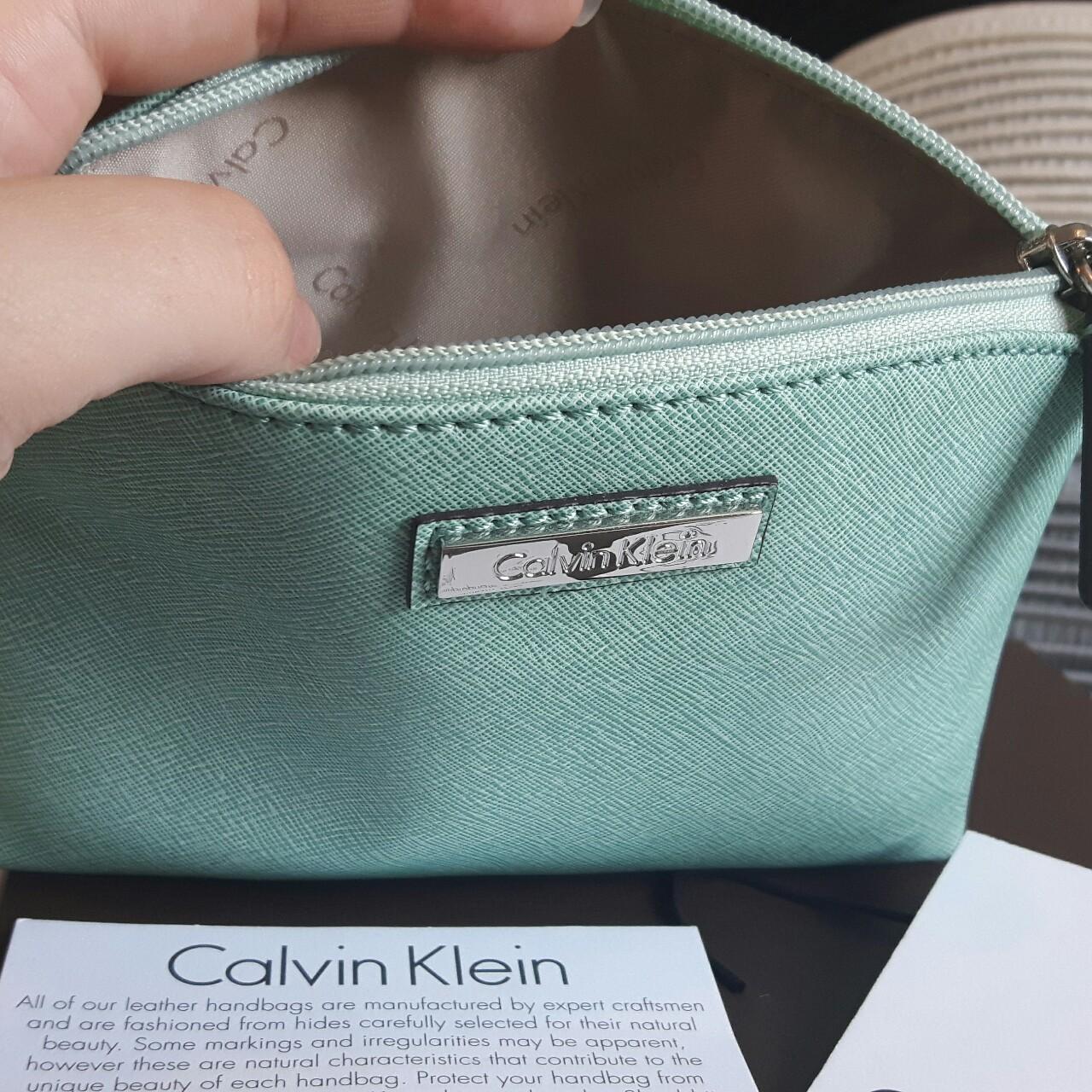 Calvin Klein mint green cosmetic bag. Originally... Depop
