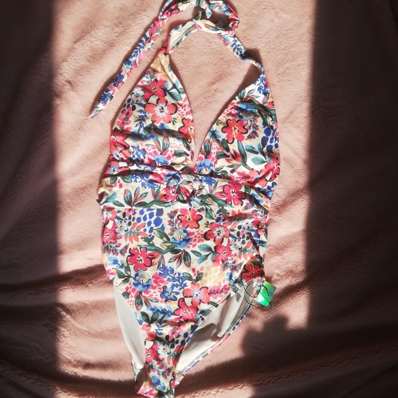 Beautiful floral swimming costume. Never worn tags... - Depop