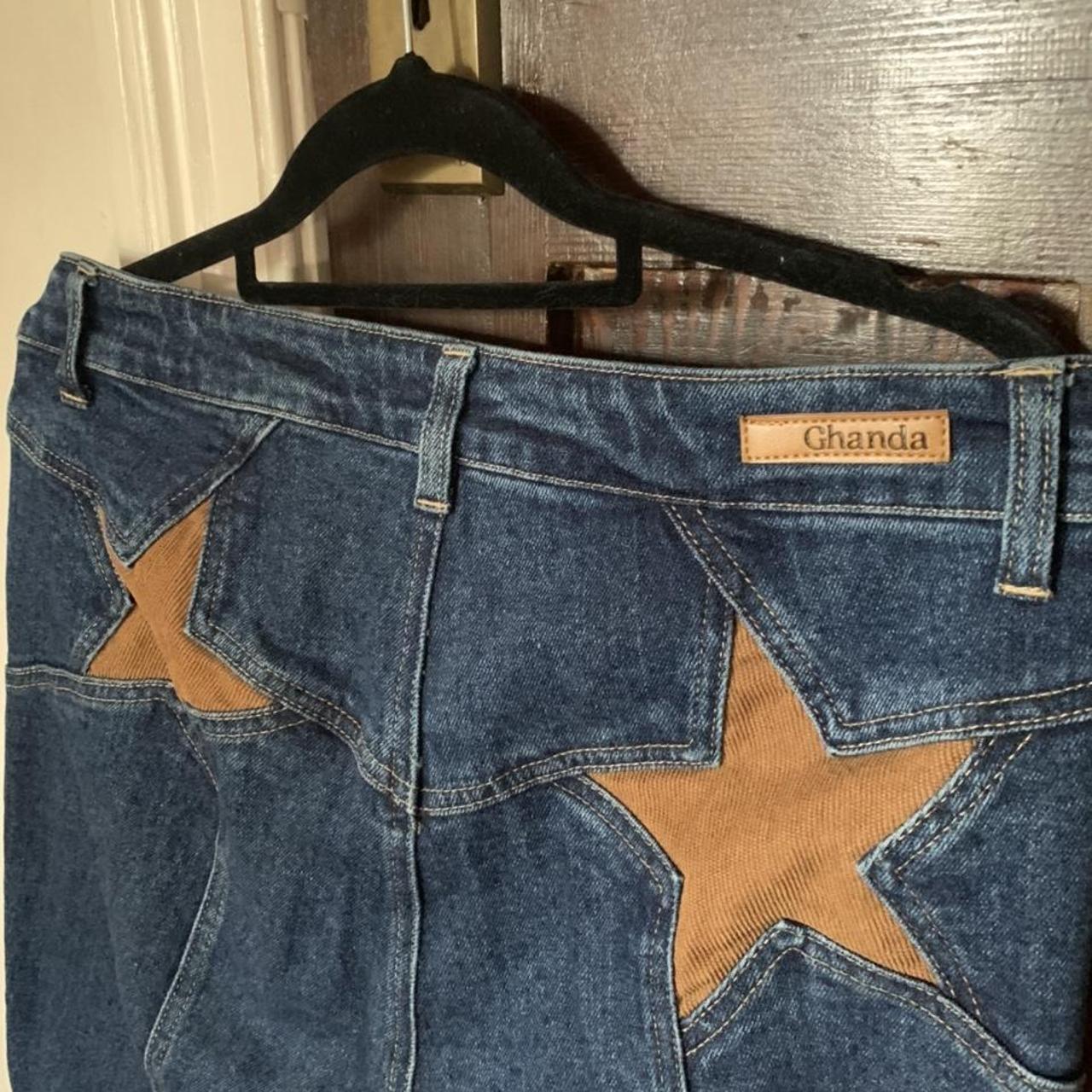 the cutest ghanda jeans!! dark blue flares with two... Depop