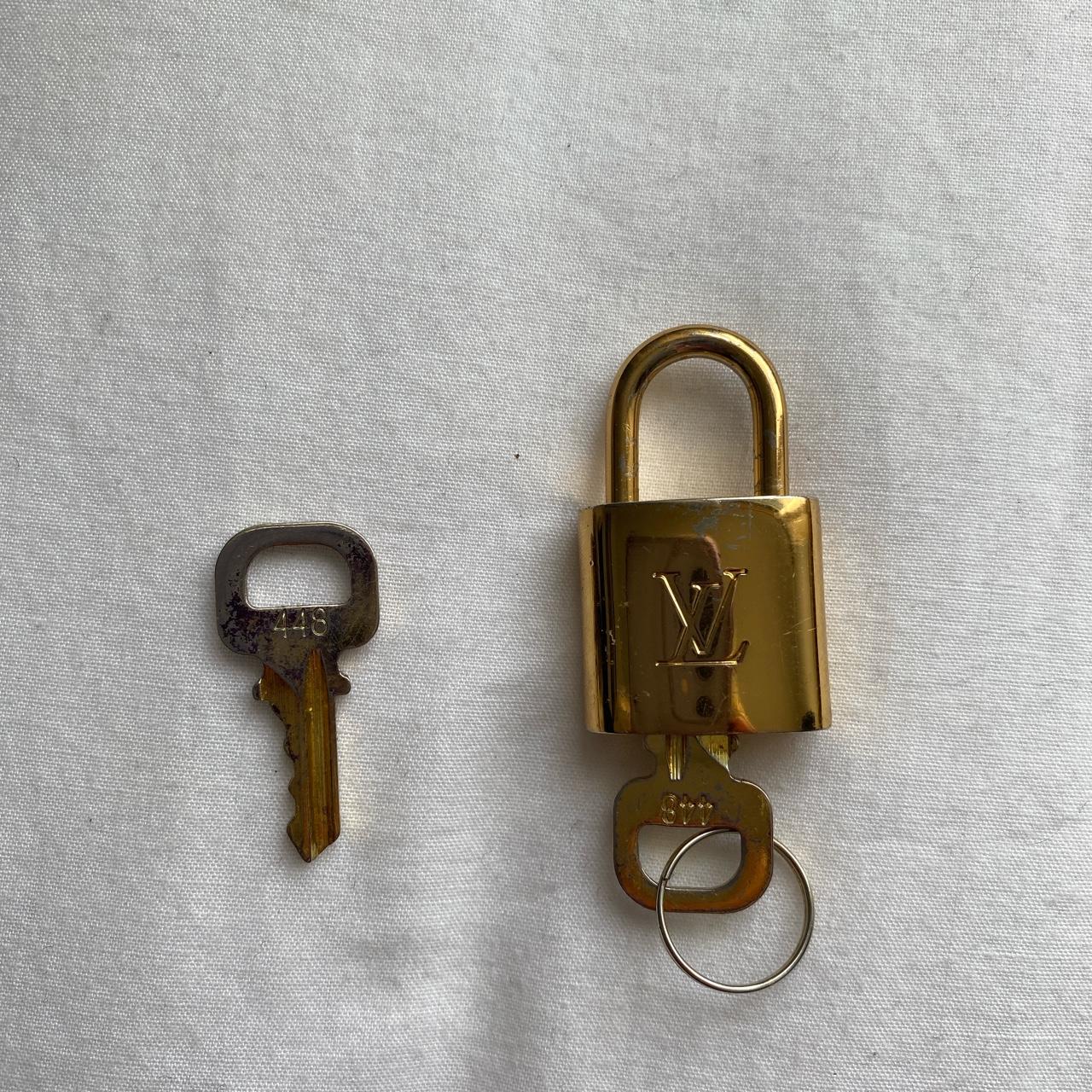 Louis Vuitton lock, in amazing condition, the spare - Depop