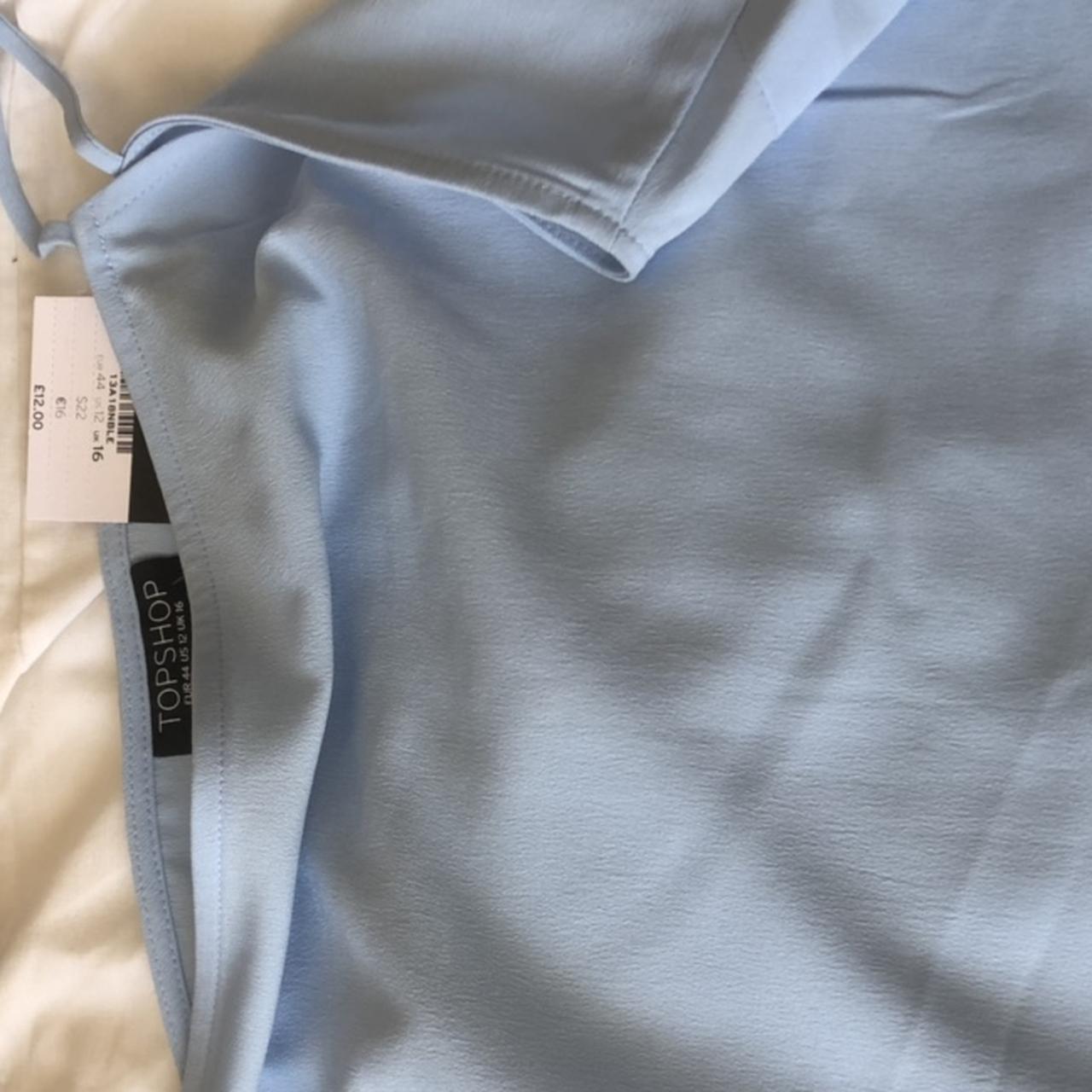 Brand new still with tags, baby blue top, is a size... - Depop