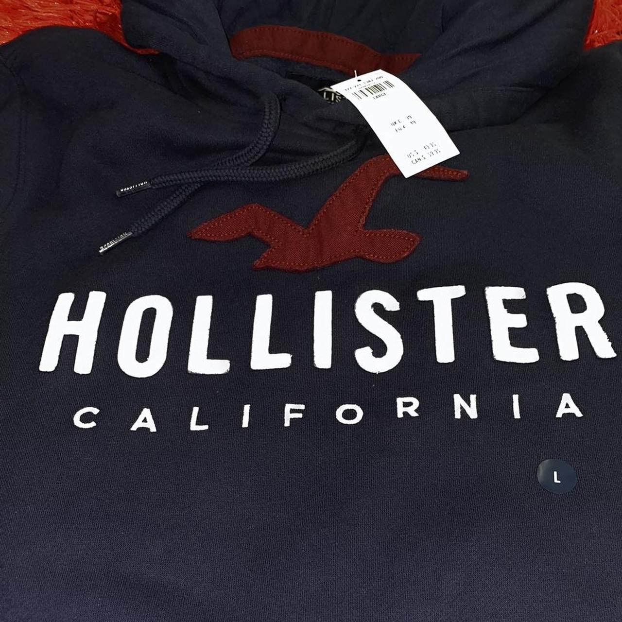 Dark Navy Hollister with a stitched patch of the... - Depop