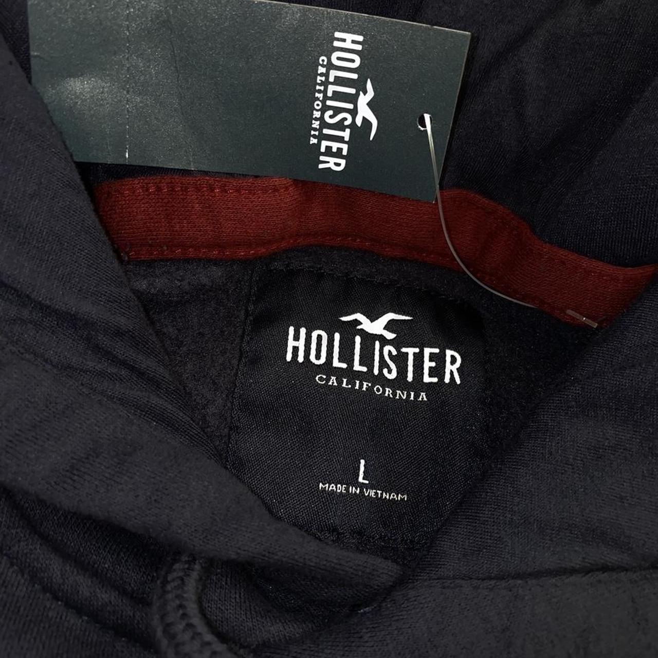 Dark Navy Hollister with a stitched patch of the... - Depop