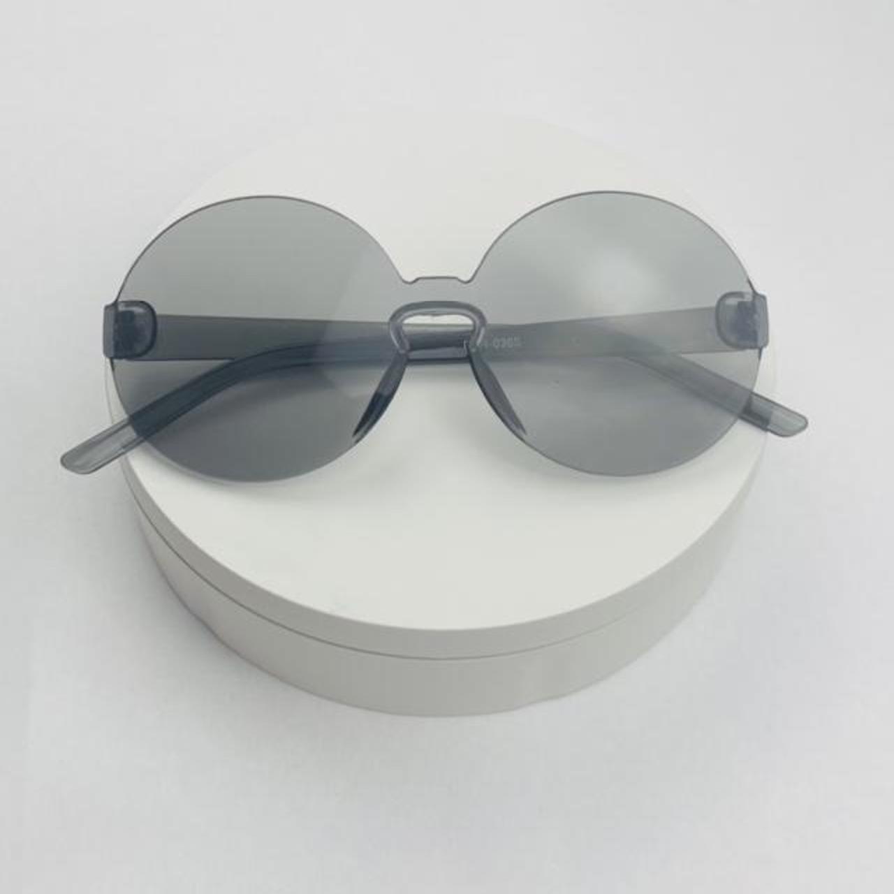 Round candy gray translucent framless sunglasses... - Depop