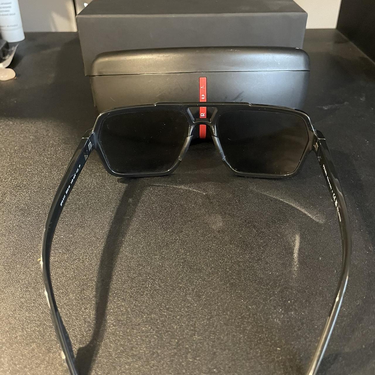 Prada Sunglasses Black Worn a couple times... - Depop
