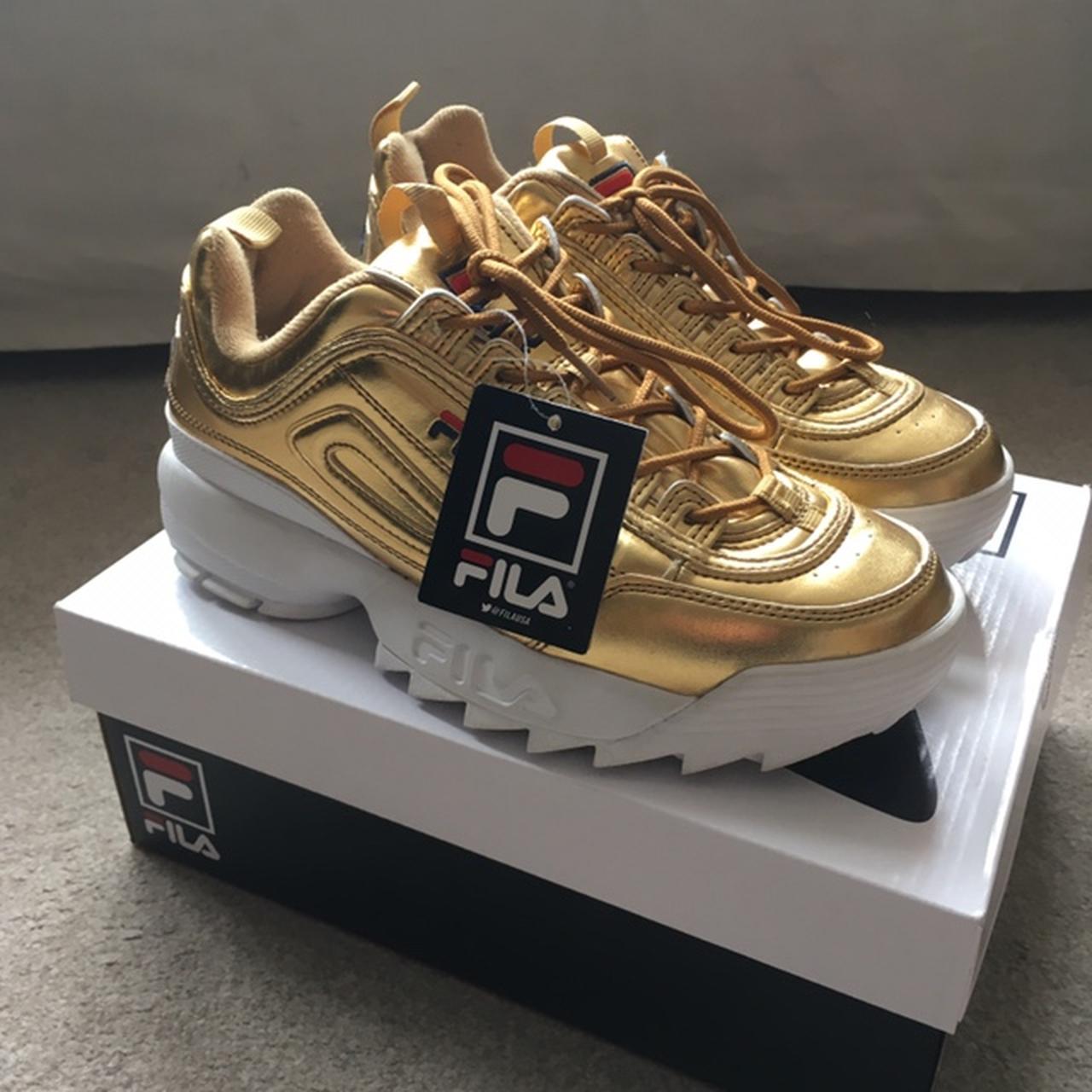 Fila disruptor low clearance gold