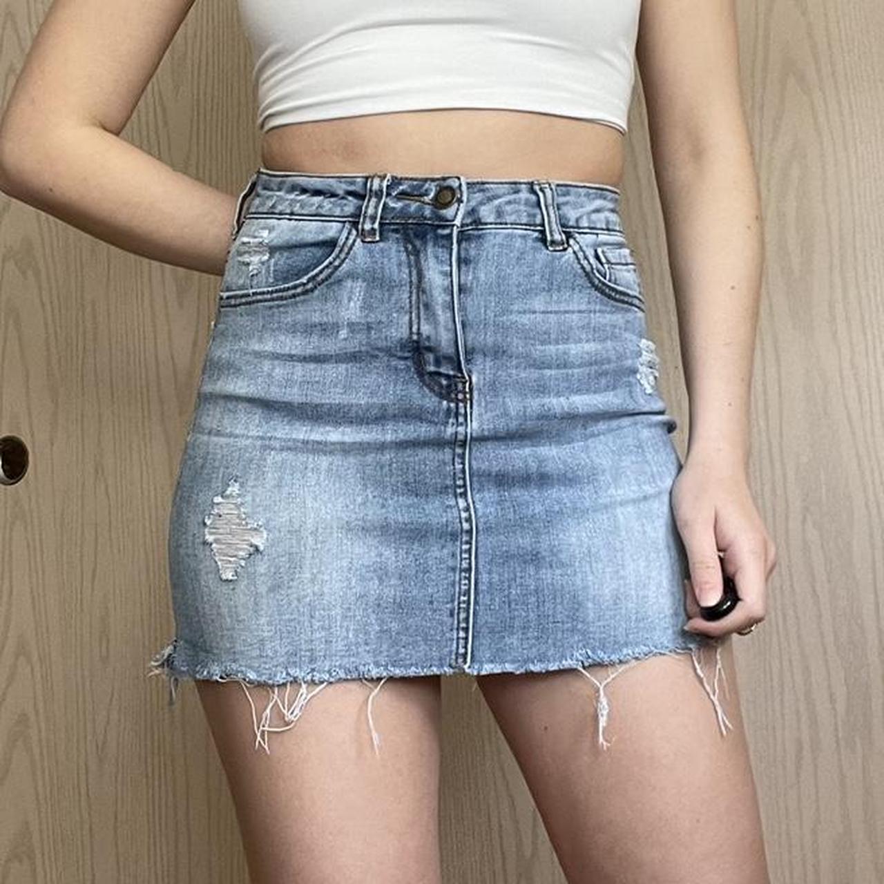 light wash denim mini skirt. not sure the size, but... - Depop