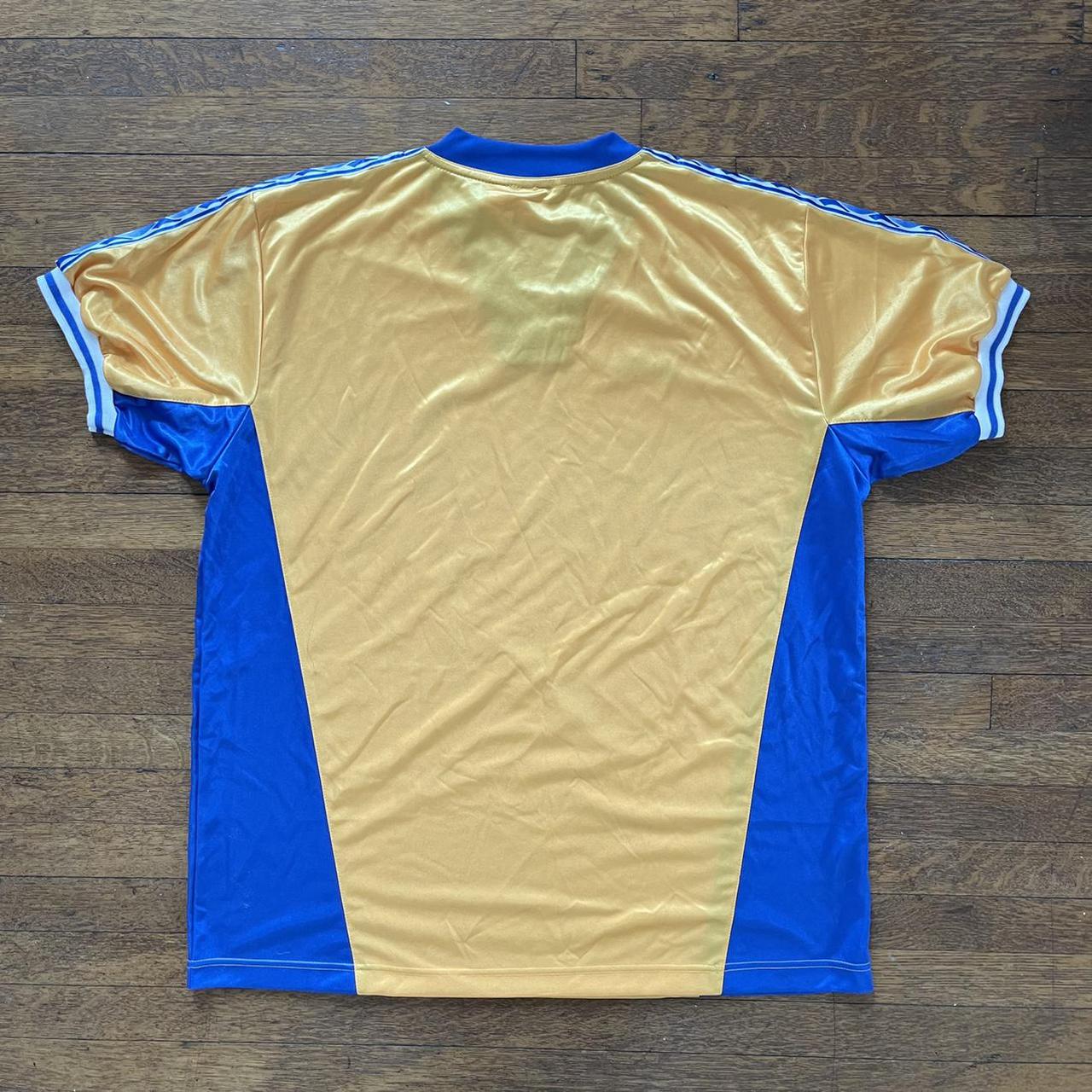 Diadora Men's Yellow and Blue T-shirt | Depop