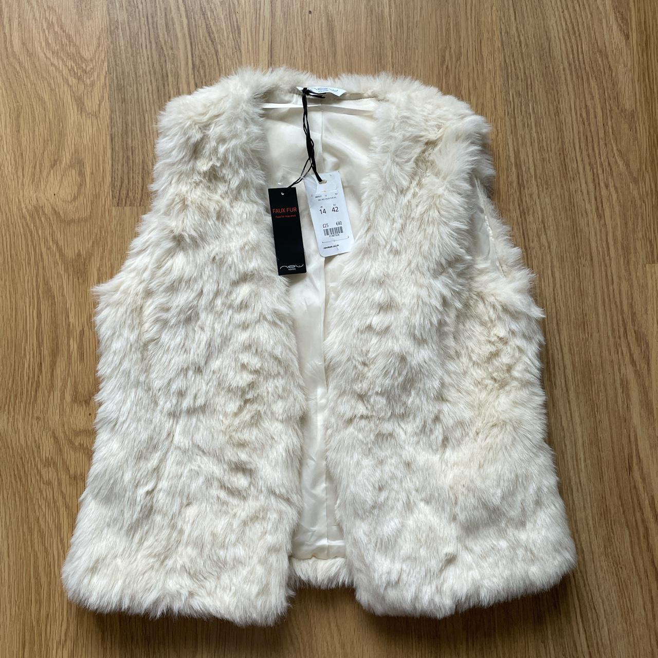 white fluffy body warmer