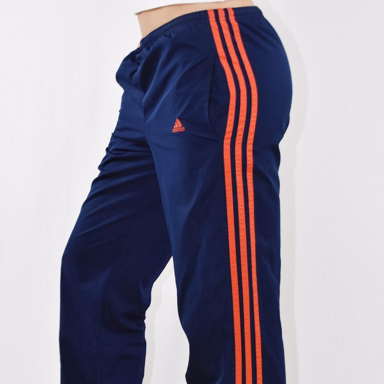 Orange and store blue track pants