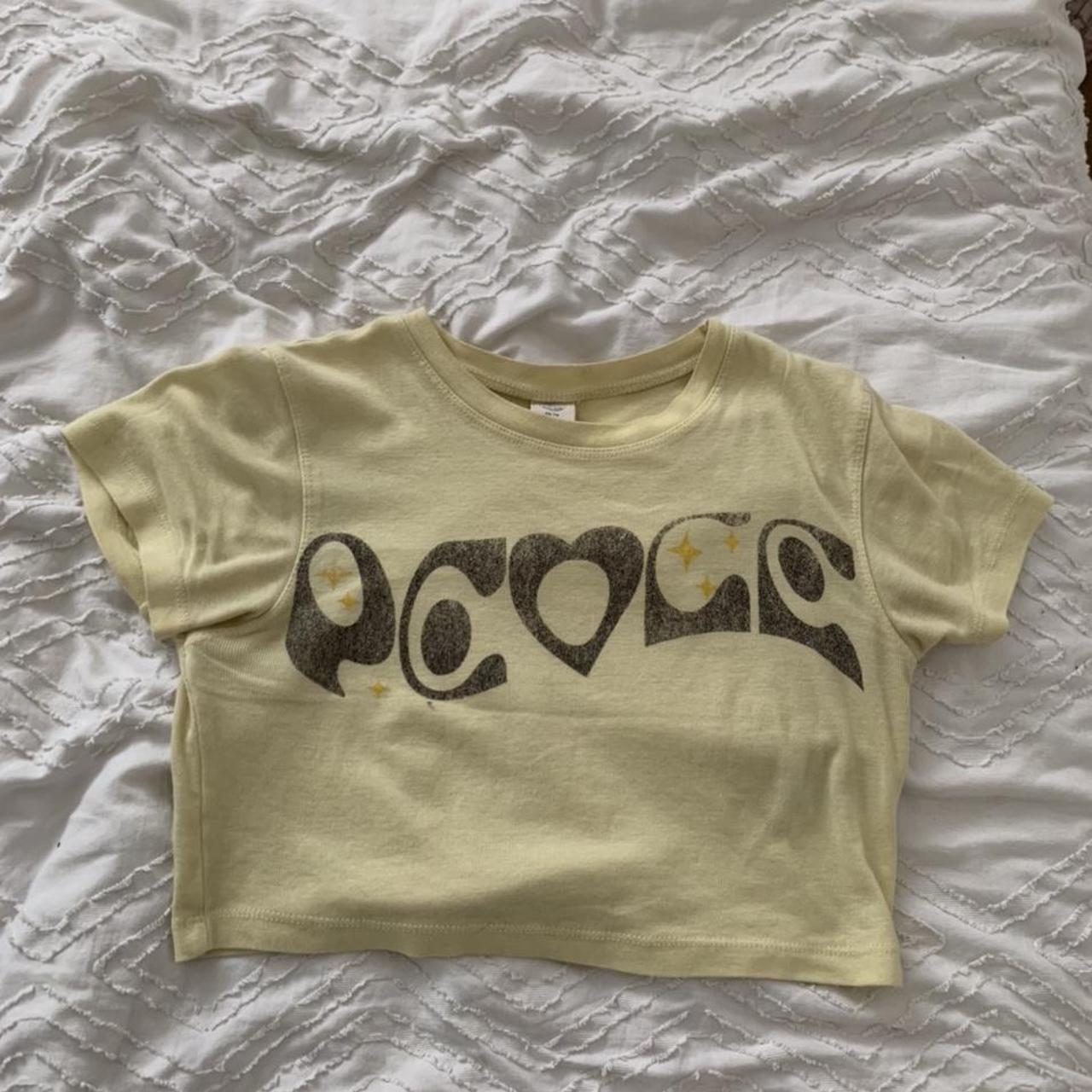 urban outfitters yellow ‘peace’ crop baby tee size... Depop